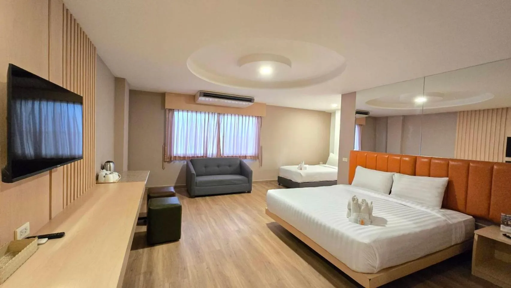 Bed in Grand Tara Garden Thai Hotel