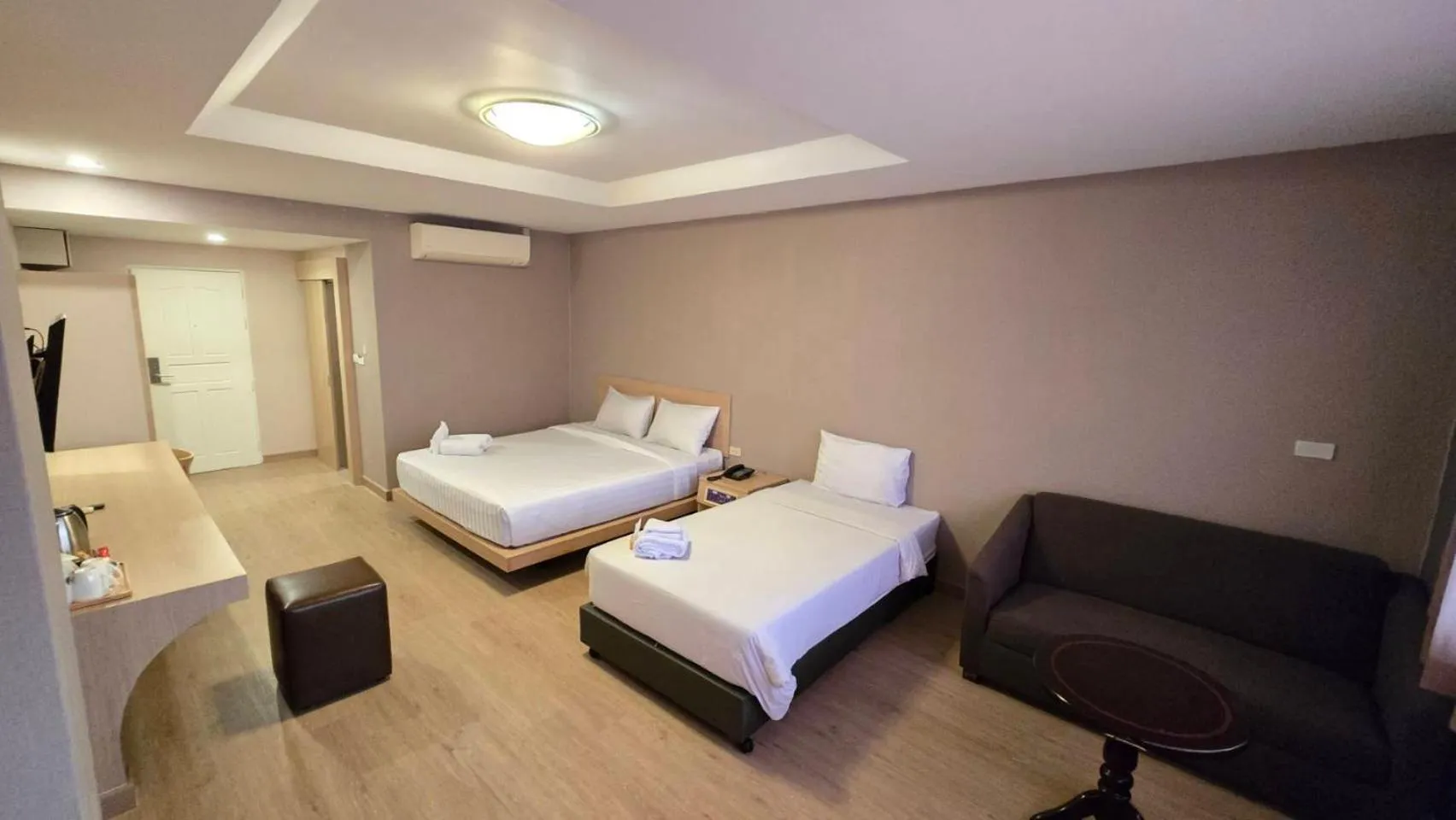 Bed in Grand Tara Garden Thai Hotel