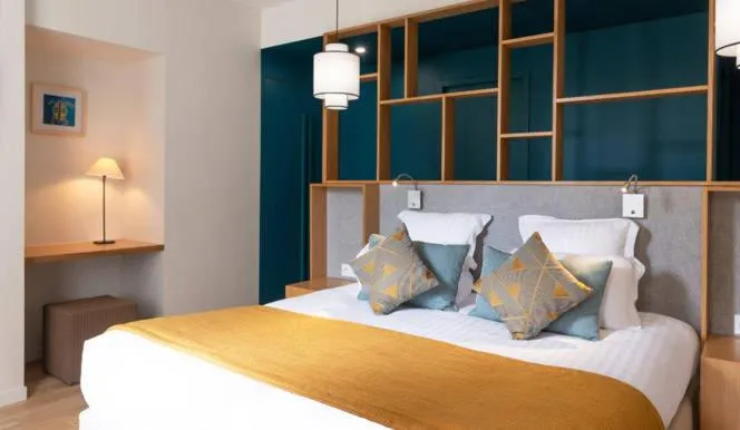 Bed in Hôtel Les Costans, The Originals Relais