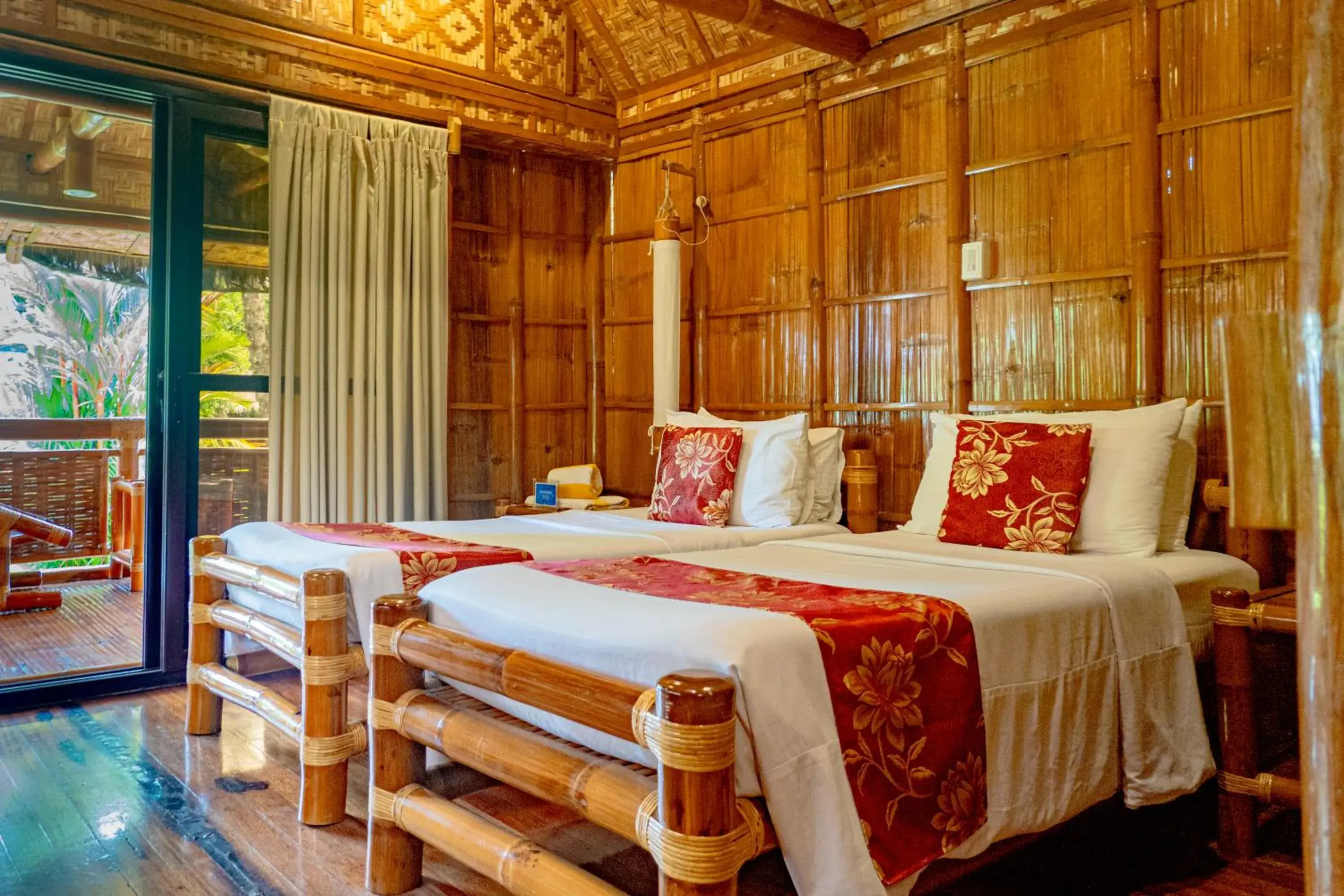 Bed in Pura Vida Beach & Dive Resort Bed in Pura Vida Beach & Dive Resort