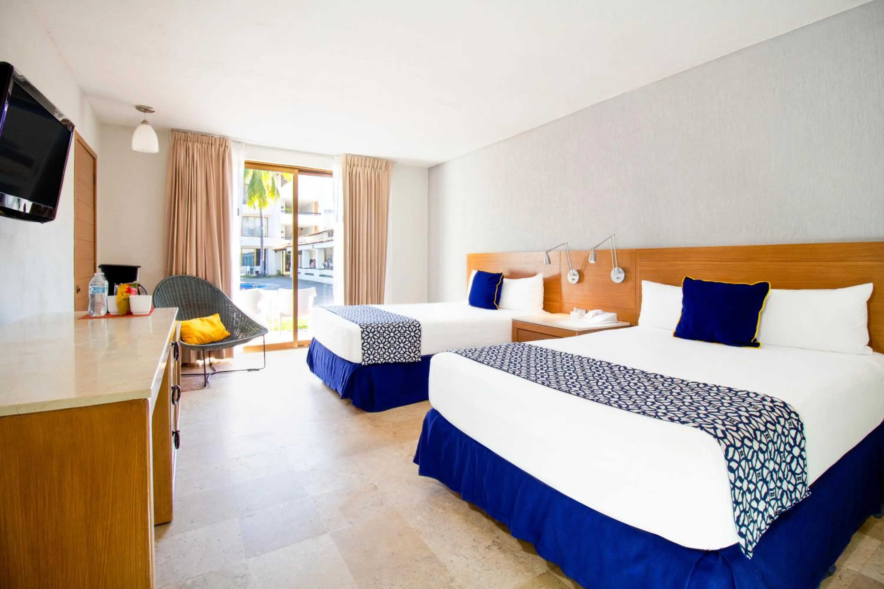 Bed in Plaza Pelicanos Club Beach Resort All Inclusive