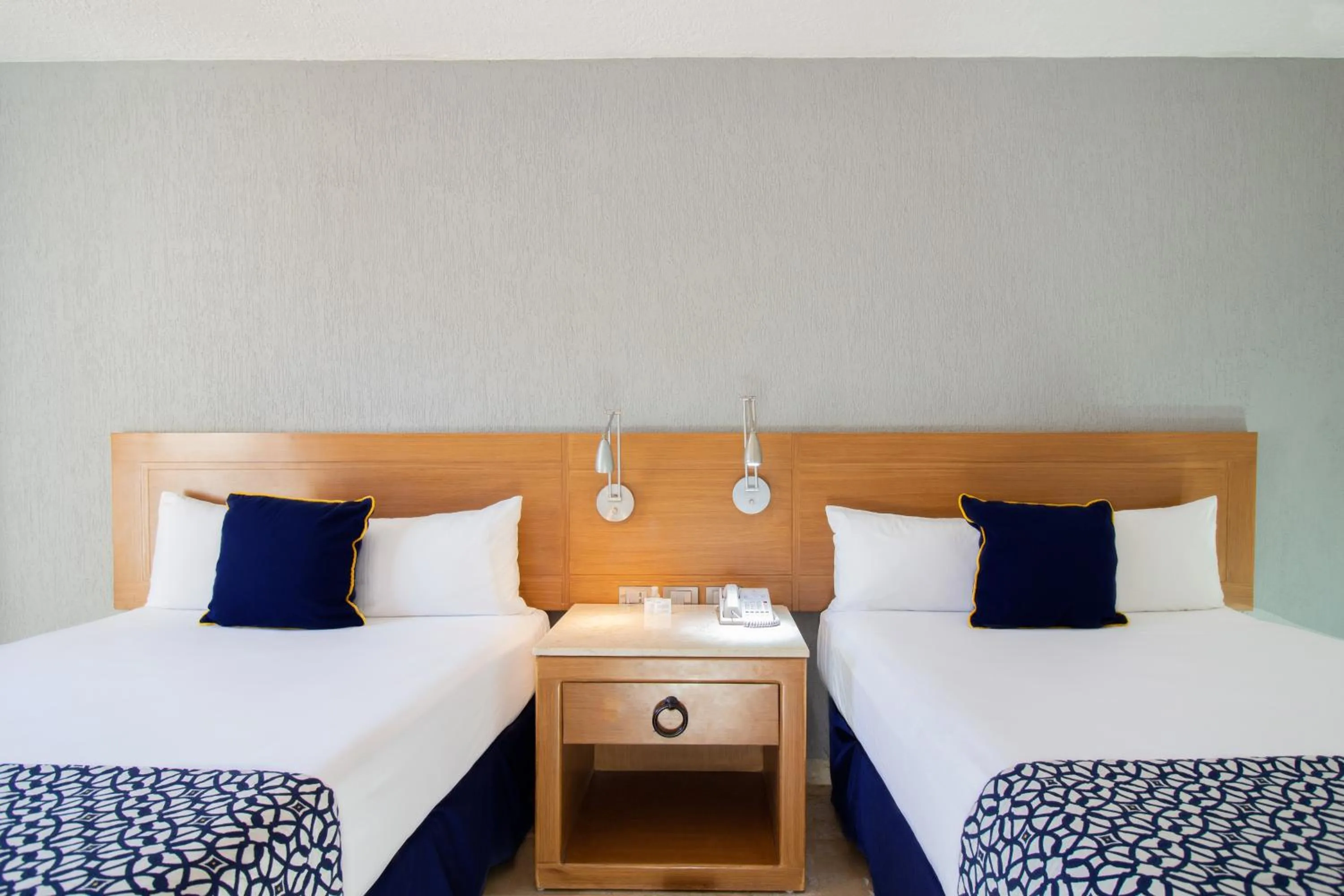 Bed in Plaza Pelicanos Club Beach Resort All Inclusive