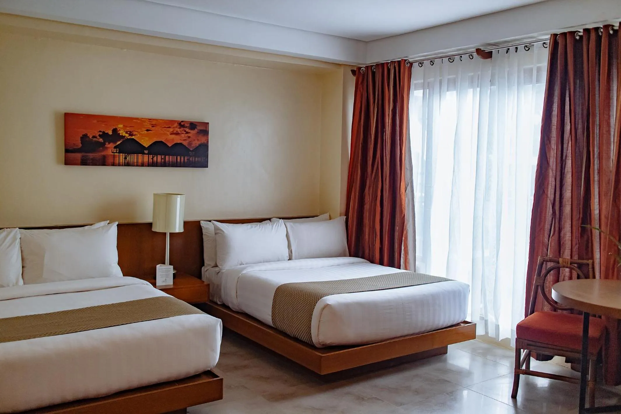 Bed in Crown Regency Beach Resort
