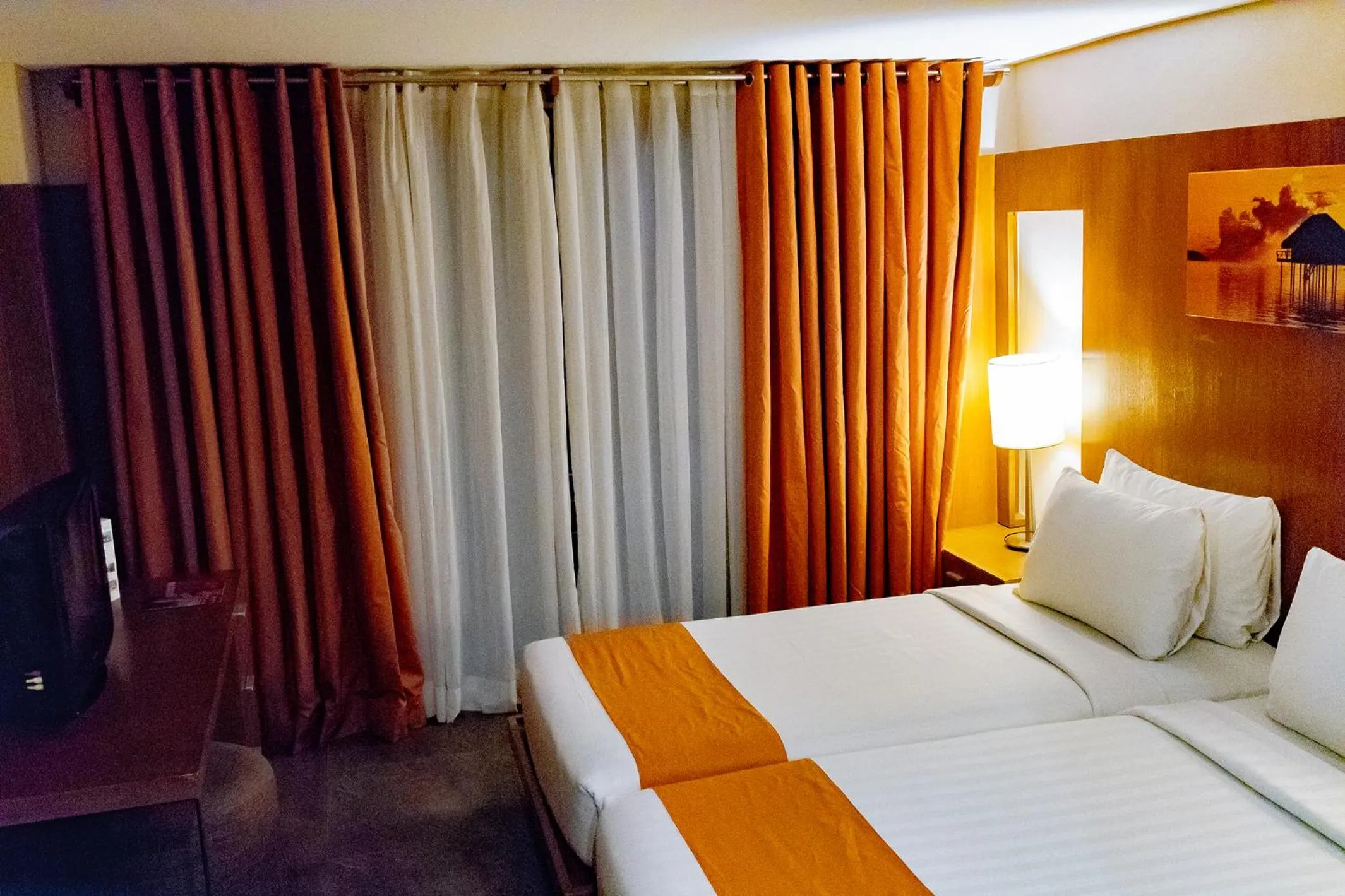 Bed in Crown Regency Beach Resort