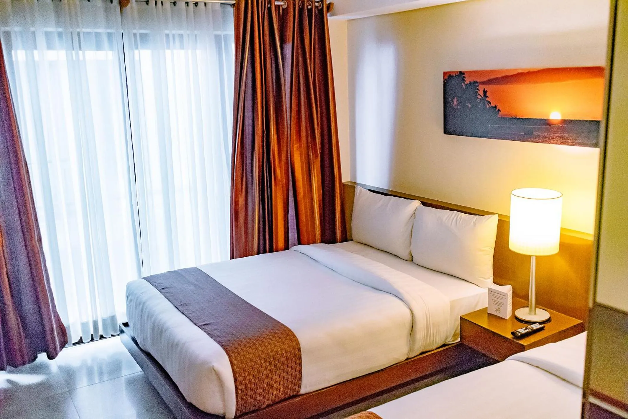 Bed in Crown Regency Beach Resort
