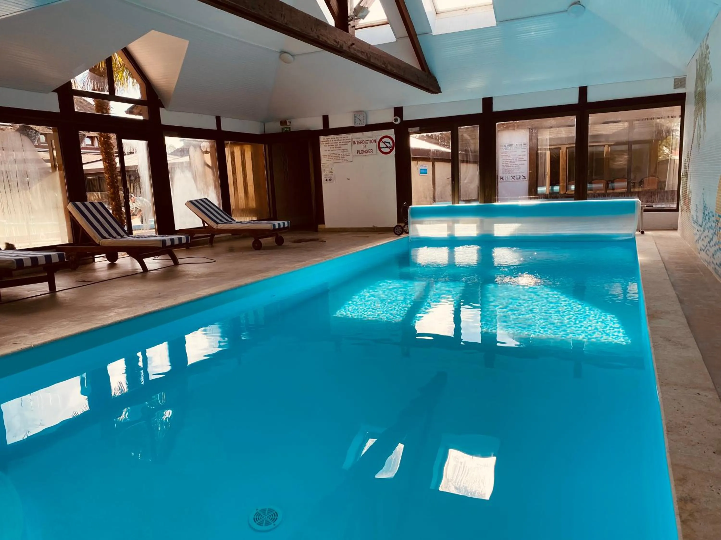 Swimming pool in Logis Le Clos Deauville Saint Gatien