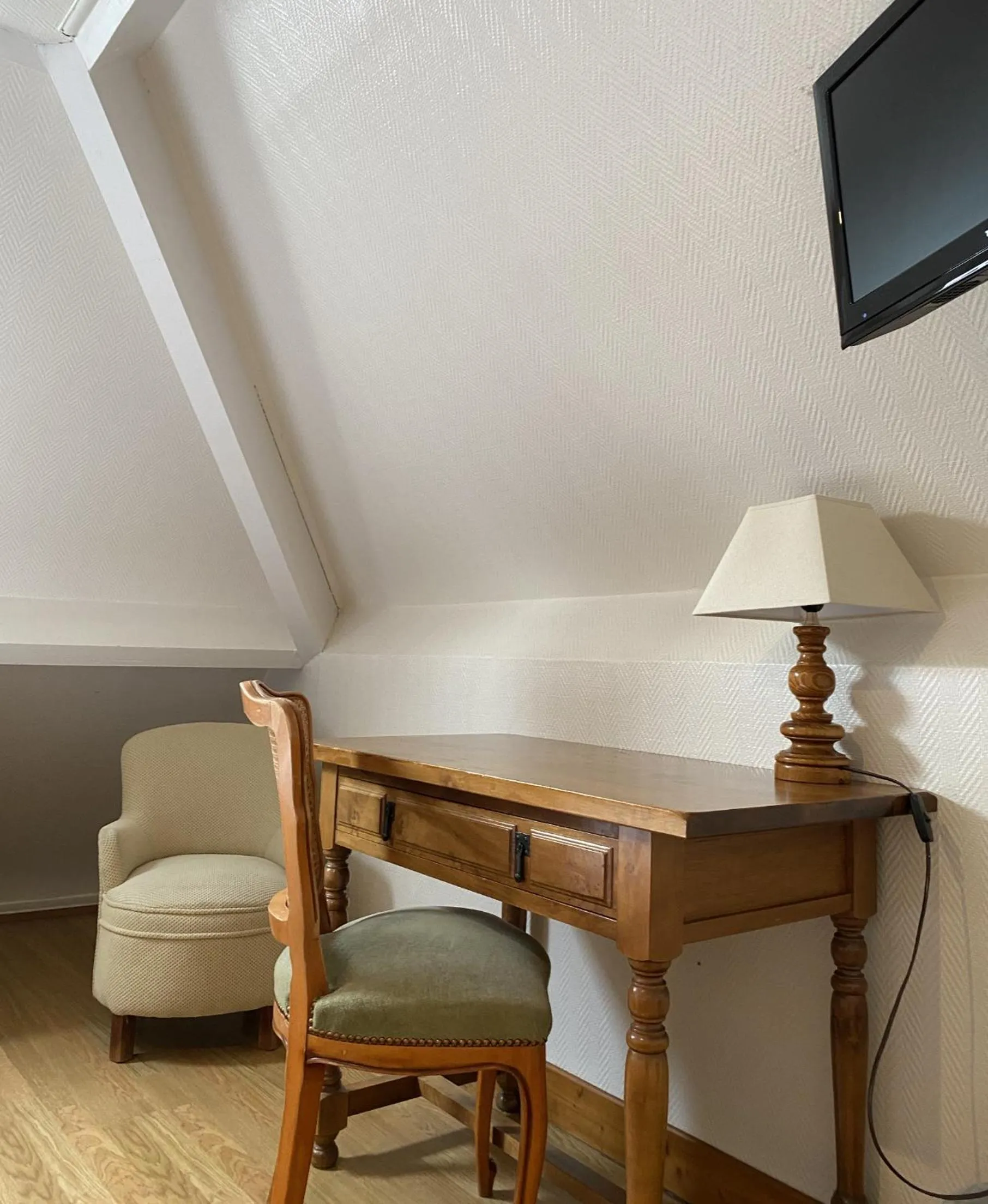 Seating area in Logis Le Clos Deauville Saint Gatien