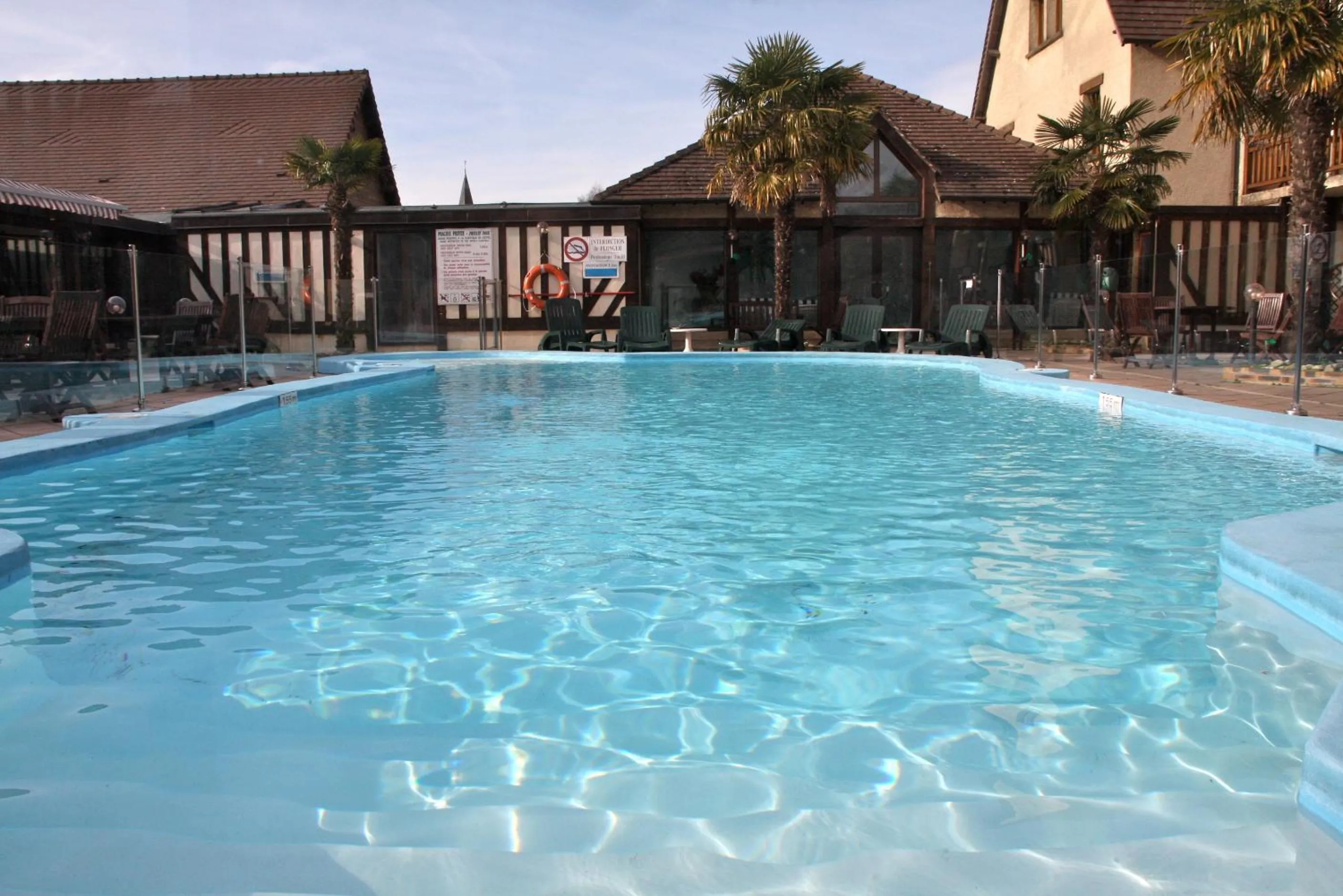 Swimming pool in Logis Le Clos Deauville Saint Gatien