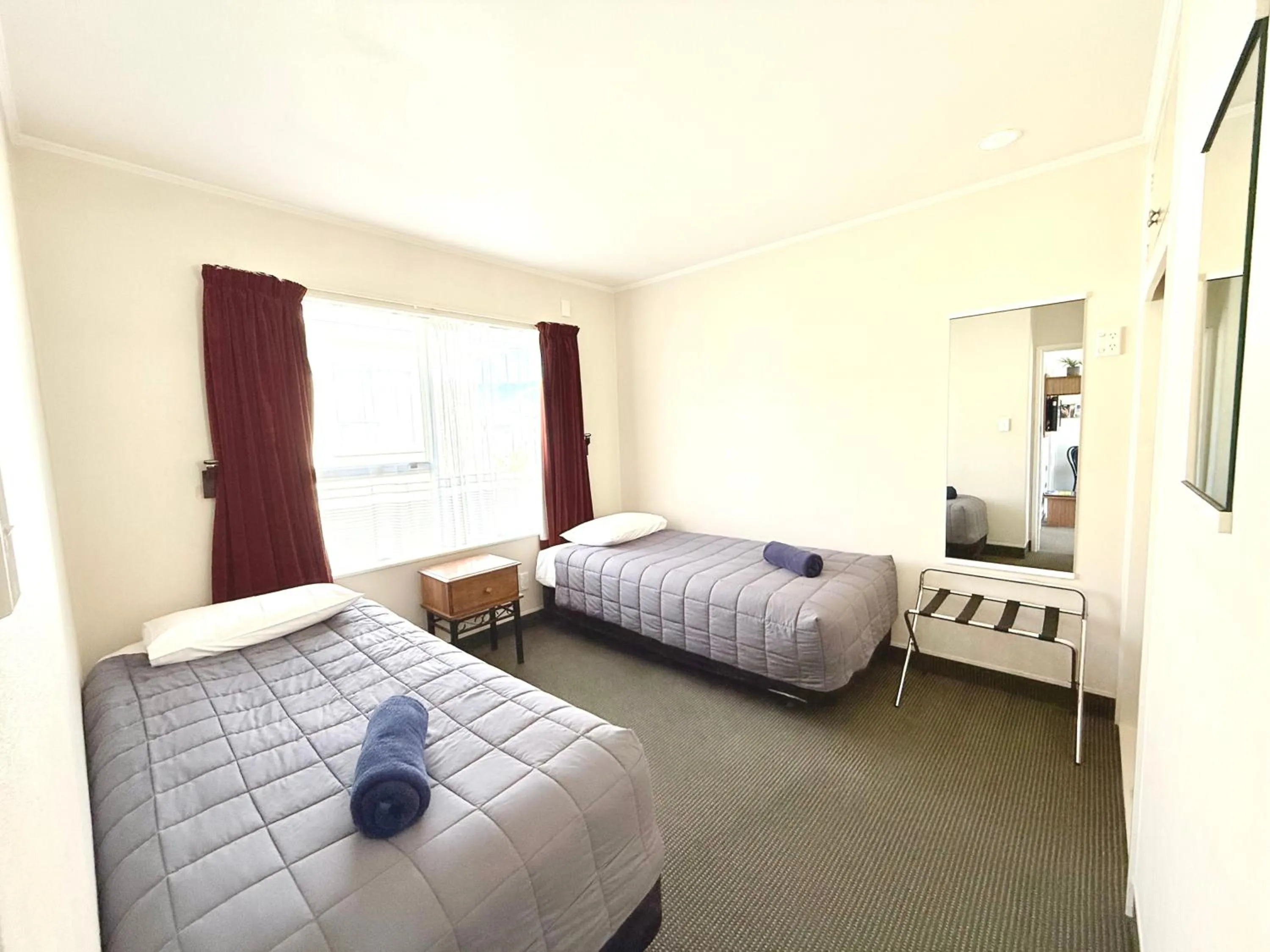 Bed in ASURE Fountain Resort Motel