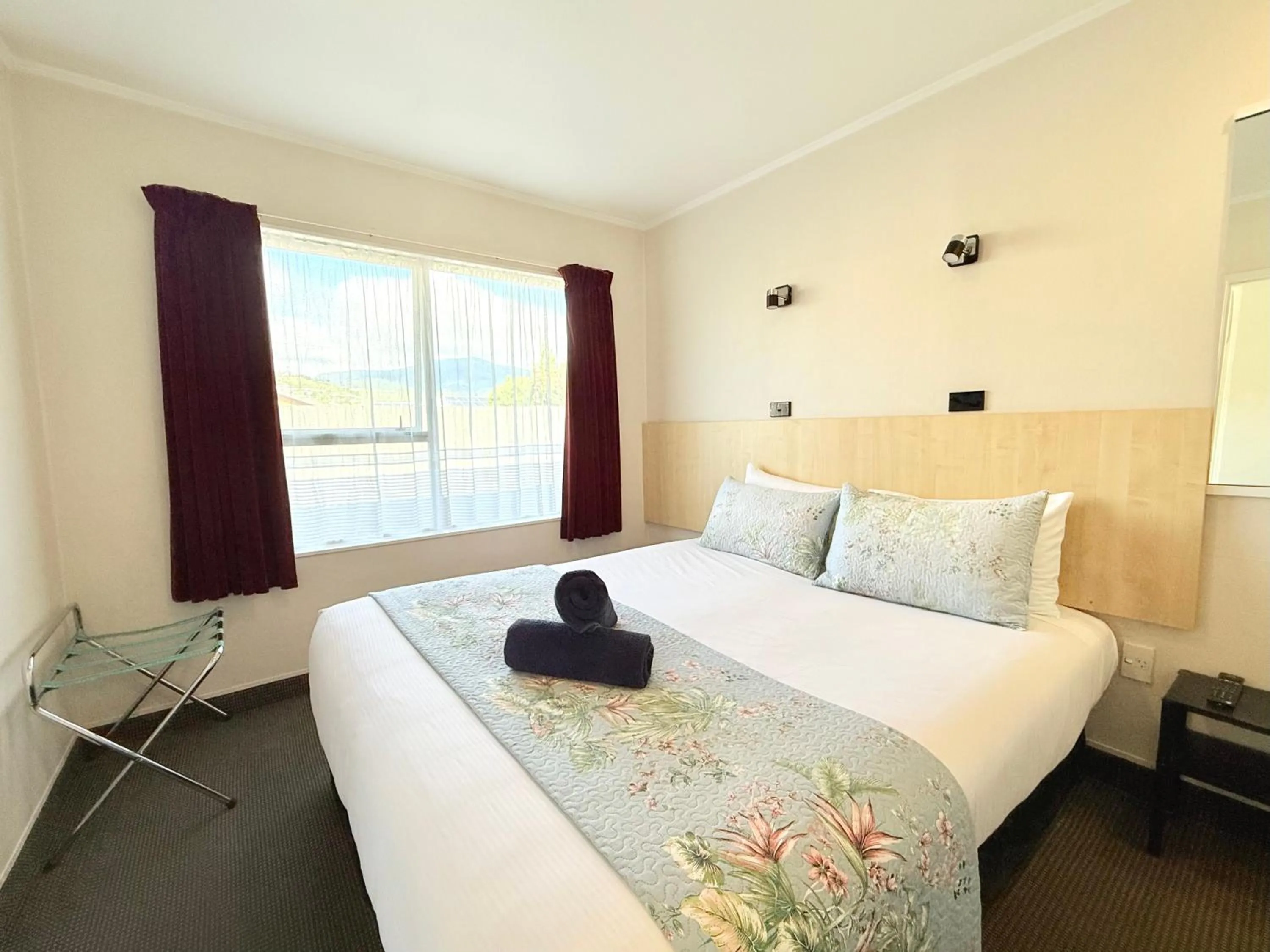 Bed in ASURE Fountain Resort Motel