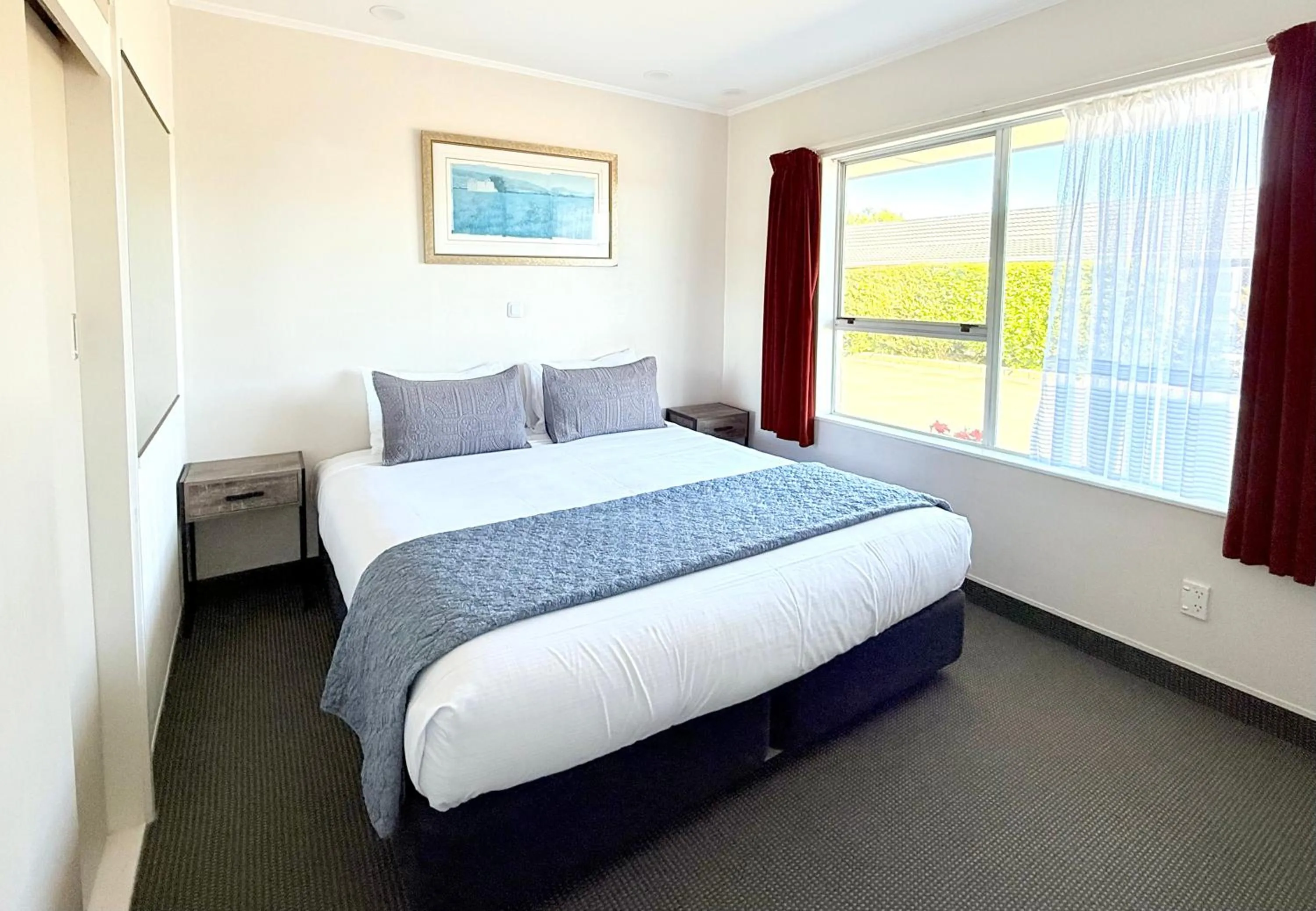 Bed in ASURE Fountain Resort Motel