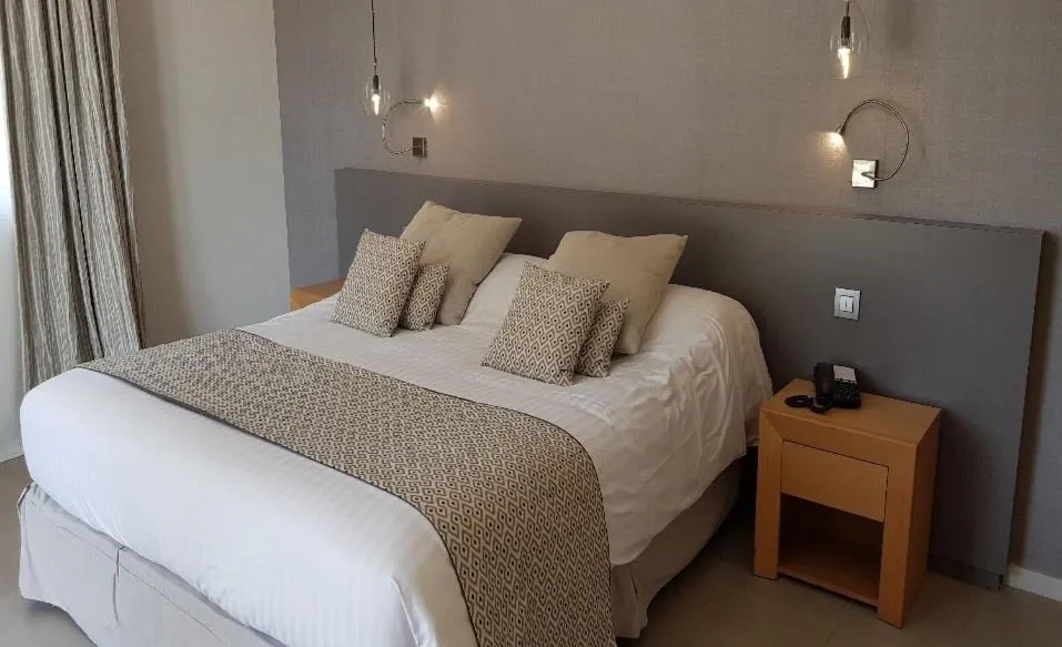 Bed in Hôtel Golf & Spa Château de la Bégude The Originals Collection