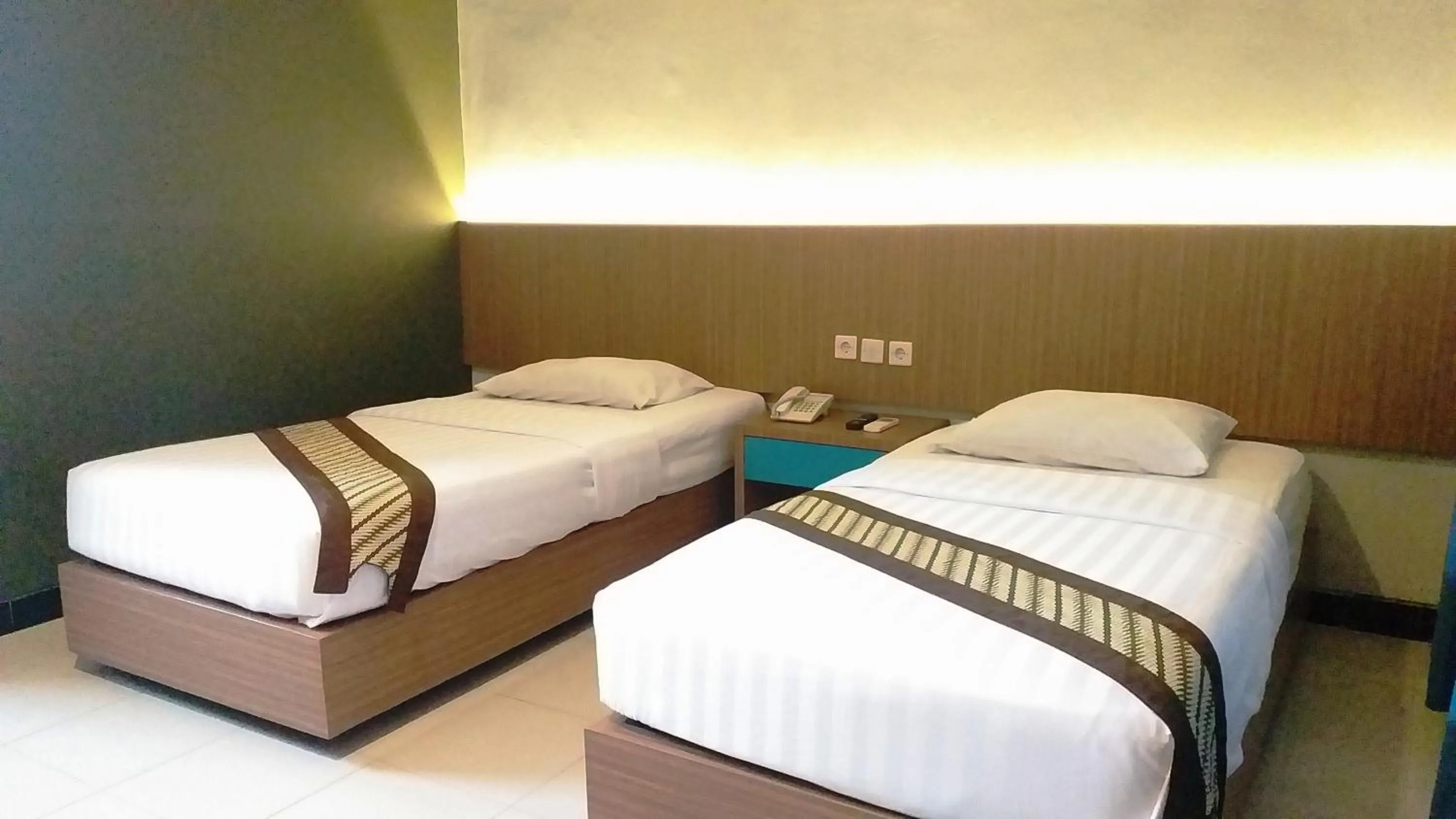 Bed in Cakra Kusuma Hotel
