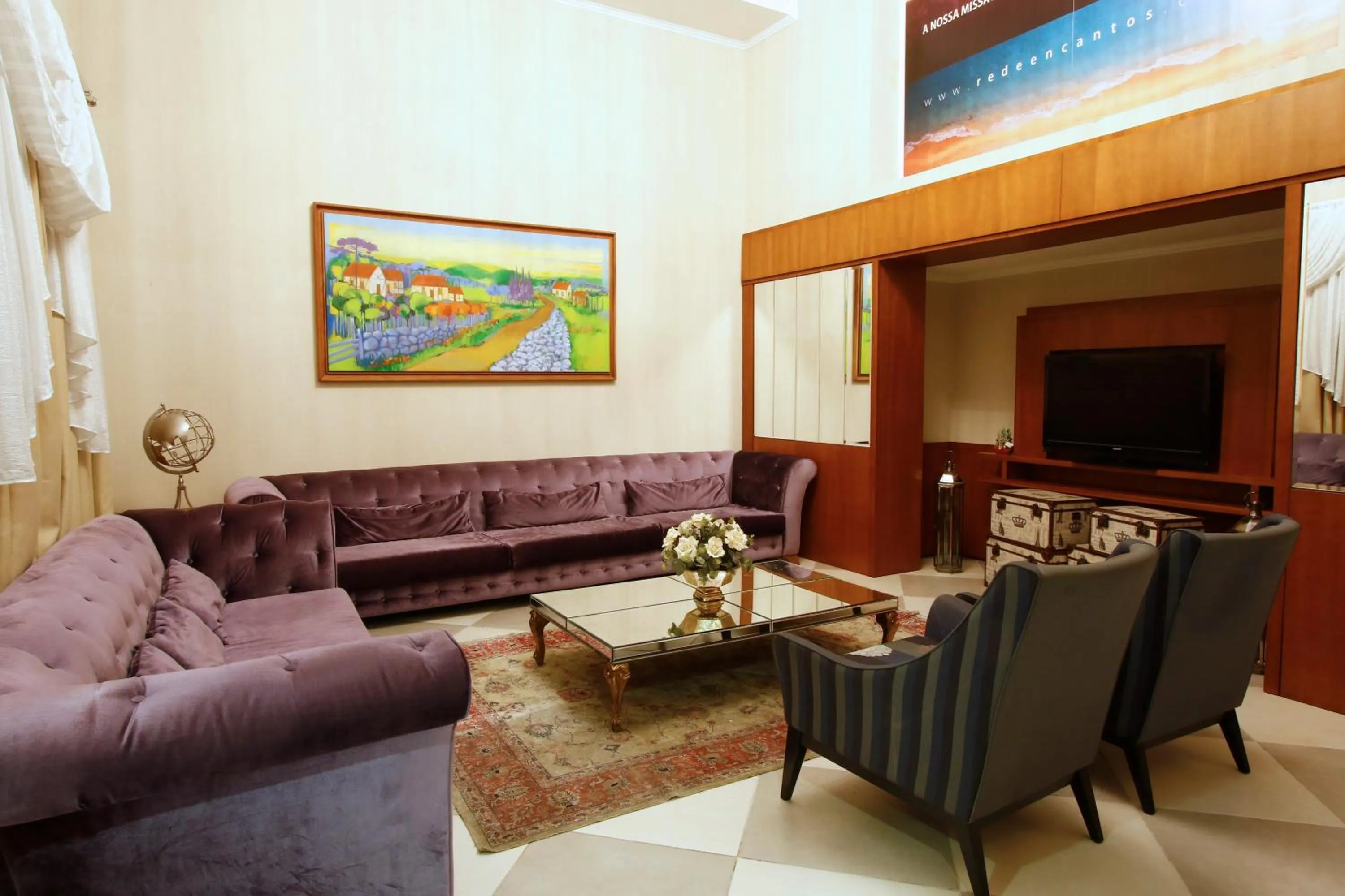 Communal lounge/ TV room in Life Hotel Infinity