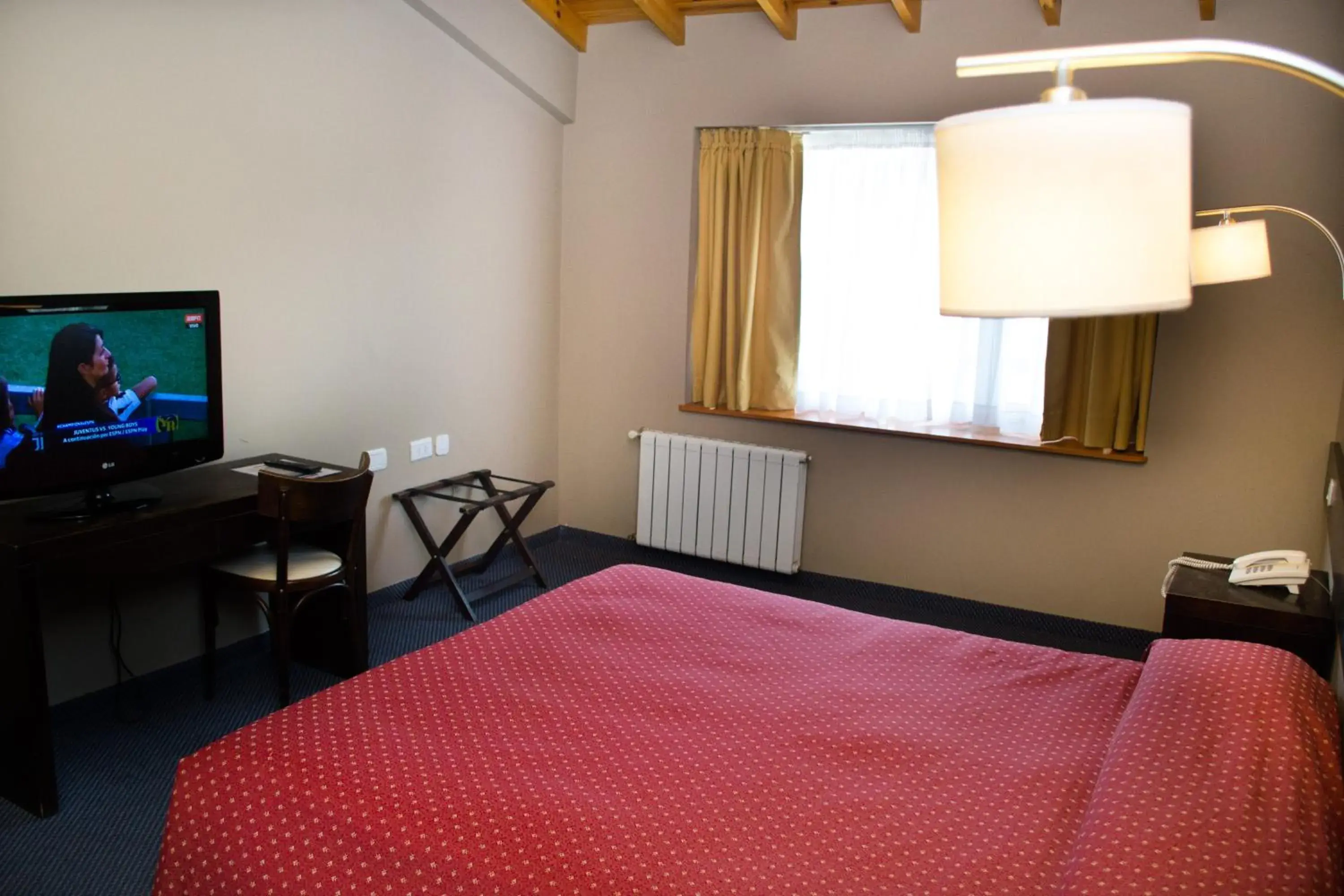 Photo of the whole room, Bed in Marcopolo Suites Calafate Photo of the whole room, Bed in Marcopolo Suites Calafate
