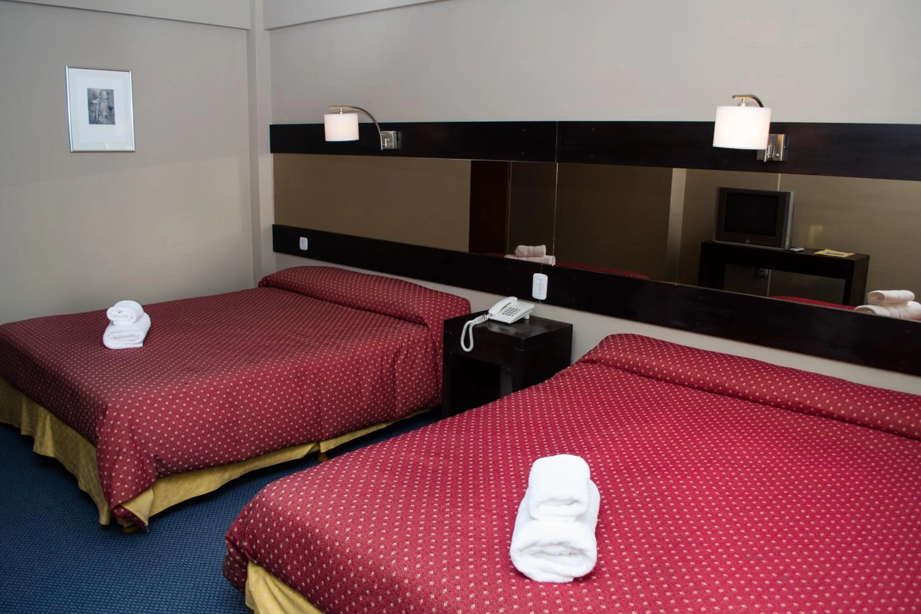 Bed in Marcopolo Suites Calafate