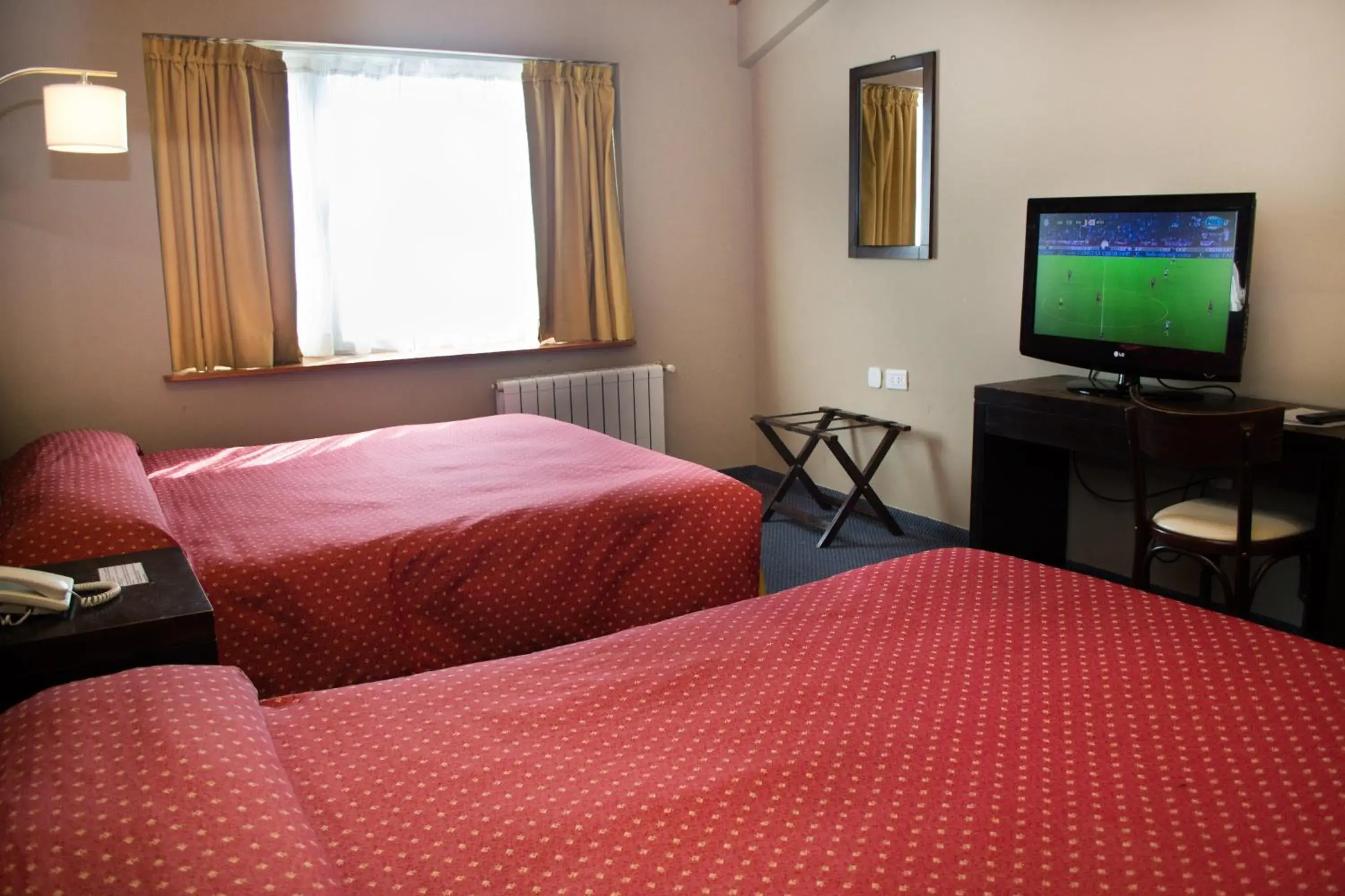 Photo of the whole room, Bed in Marcopolo Suites Calafate Photo of the whole room, Bed in Marcopolo Suites Calafate