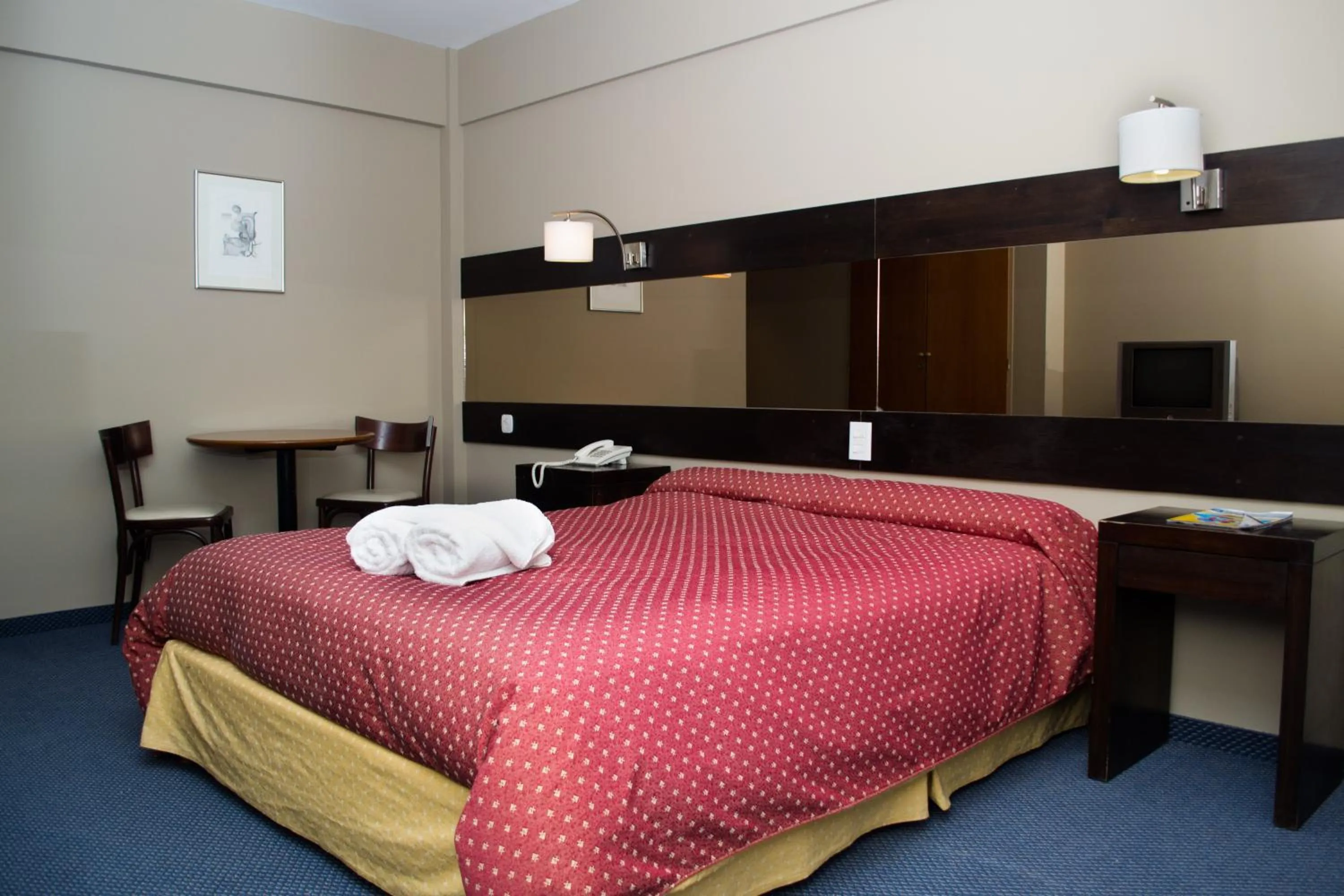 Bed in Marcopolo Suites Calafate