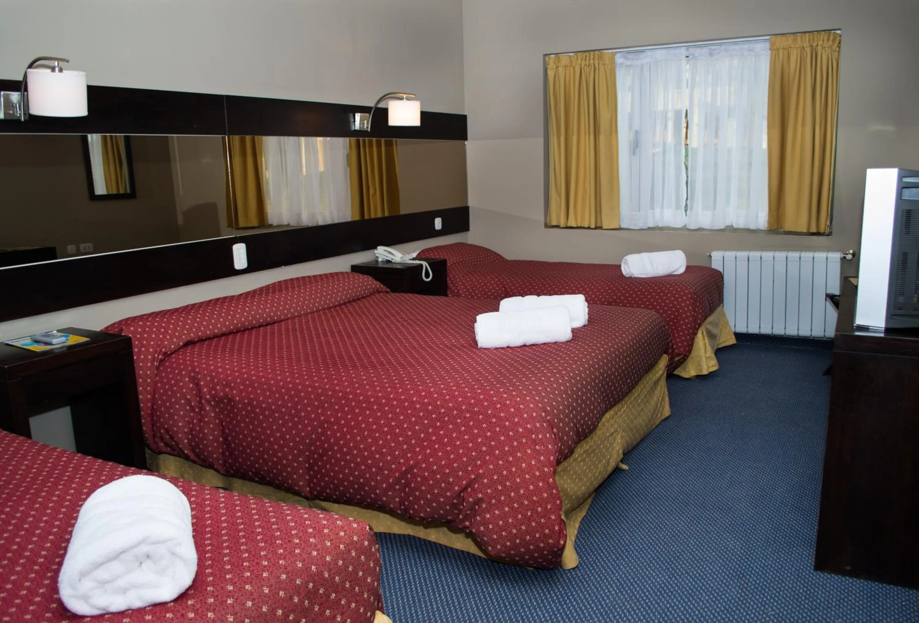 Bed in Marcopolo Suites Calafate