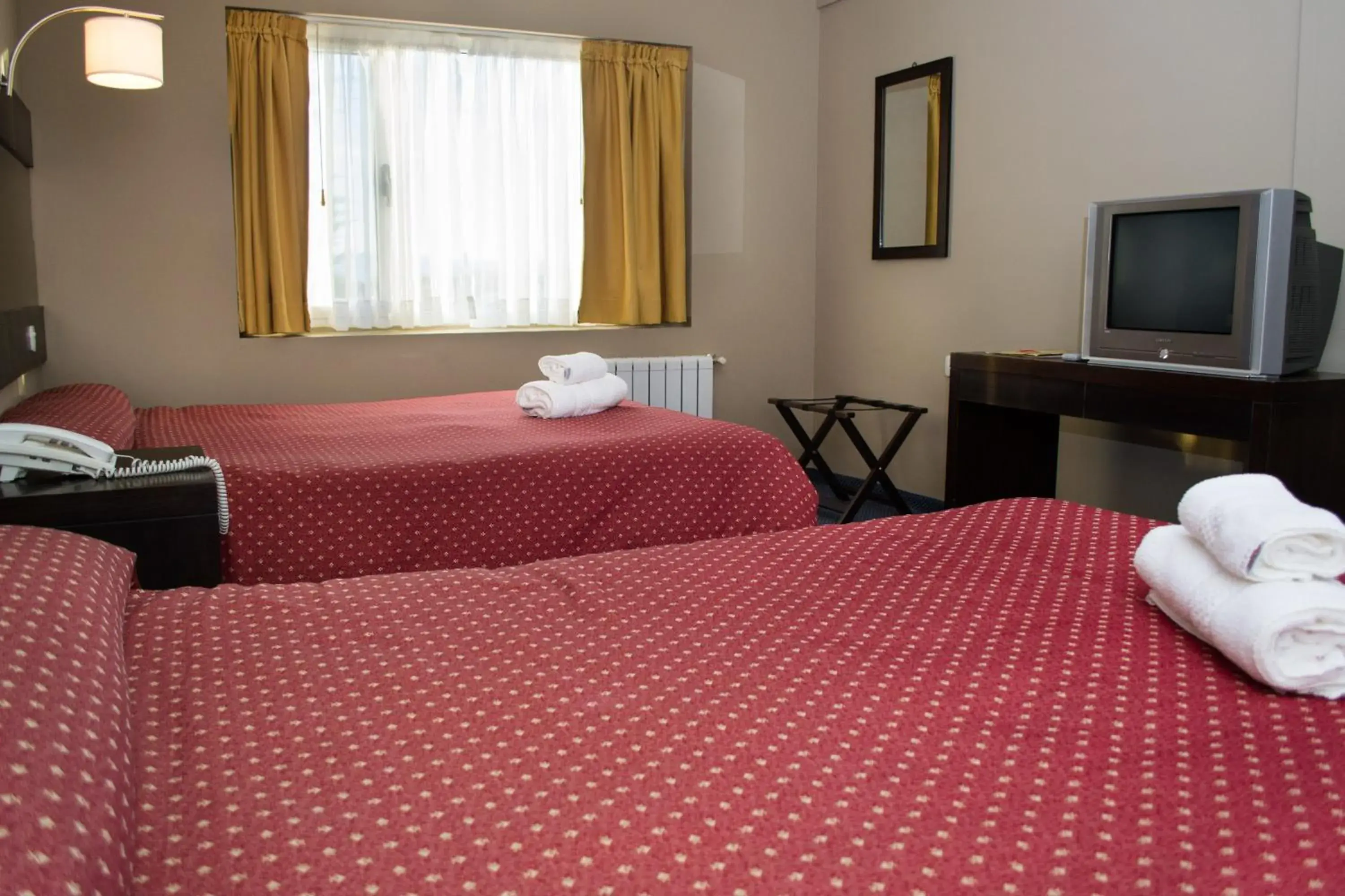 Bed in Marcopolo Suites Calafate Bed in Marcopolo Suites Calafate