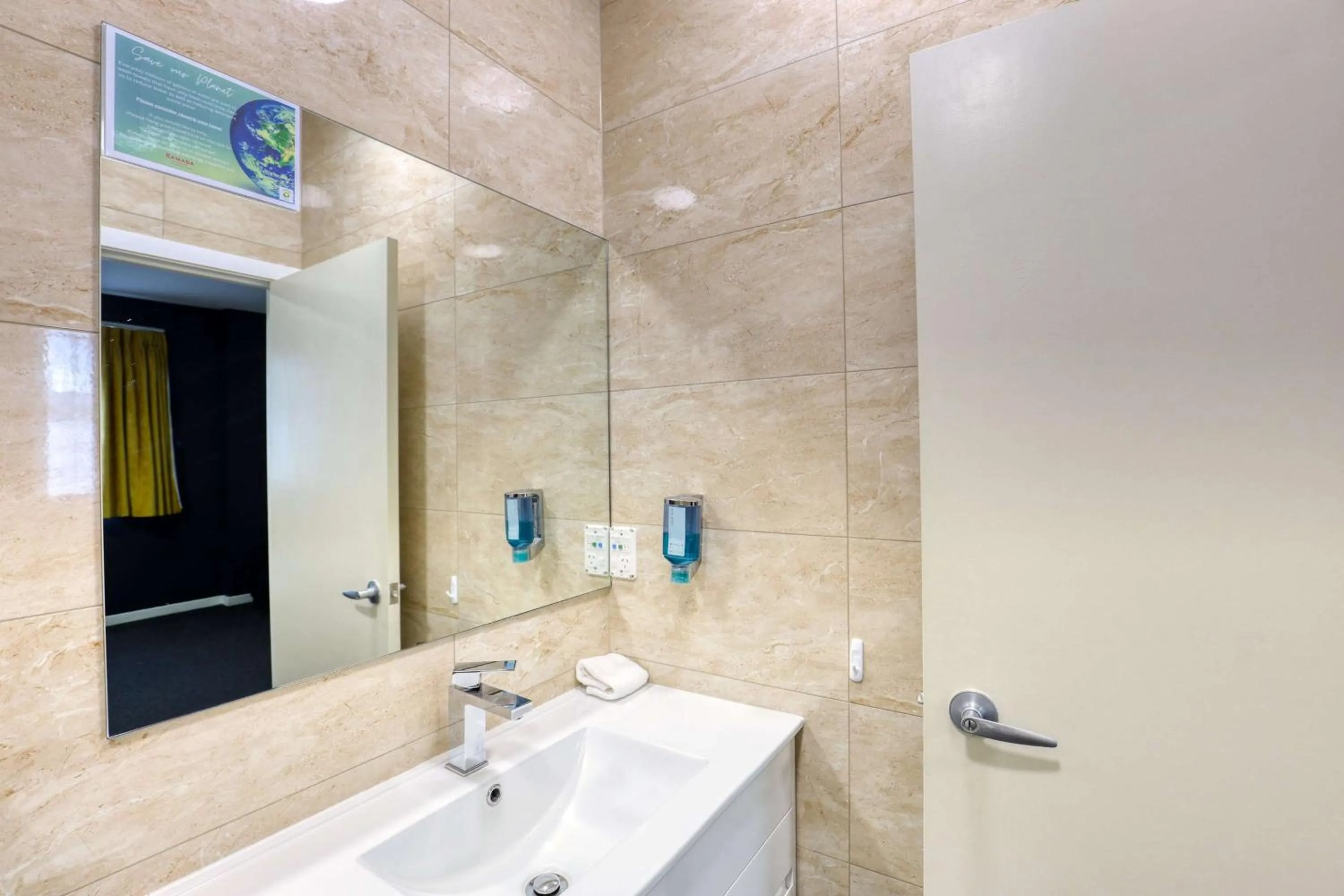 Bathroom in Ramada by Wyndham, Hamilton City Center