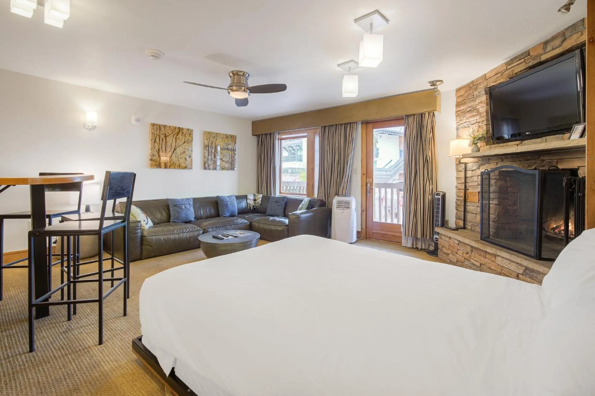 Living room, Bed in Lodge at Vail, A RockResort by Vail Resorts