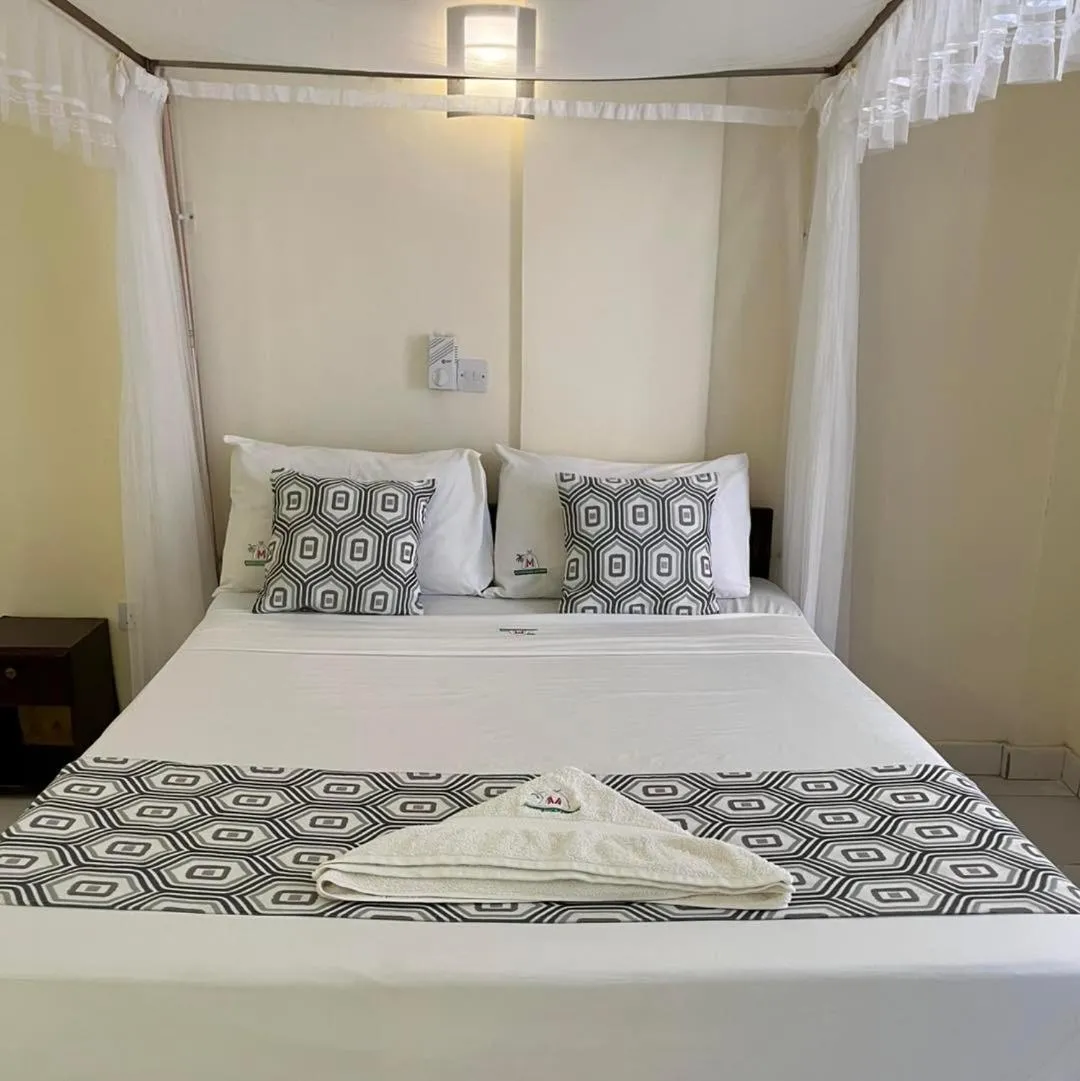 Bed in Merry Villa Hotel & Apartments