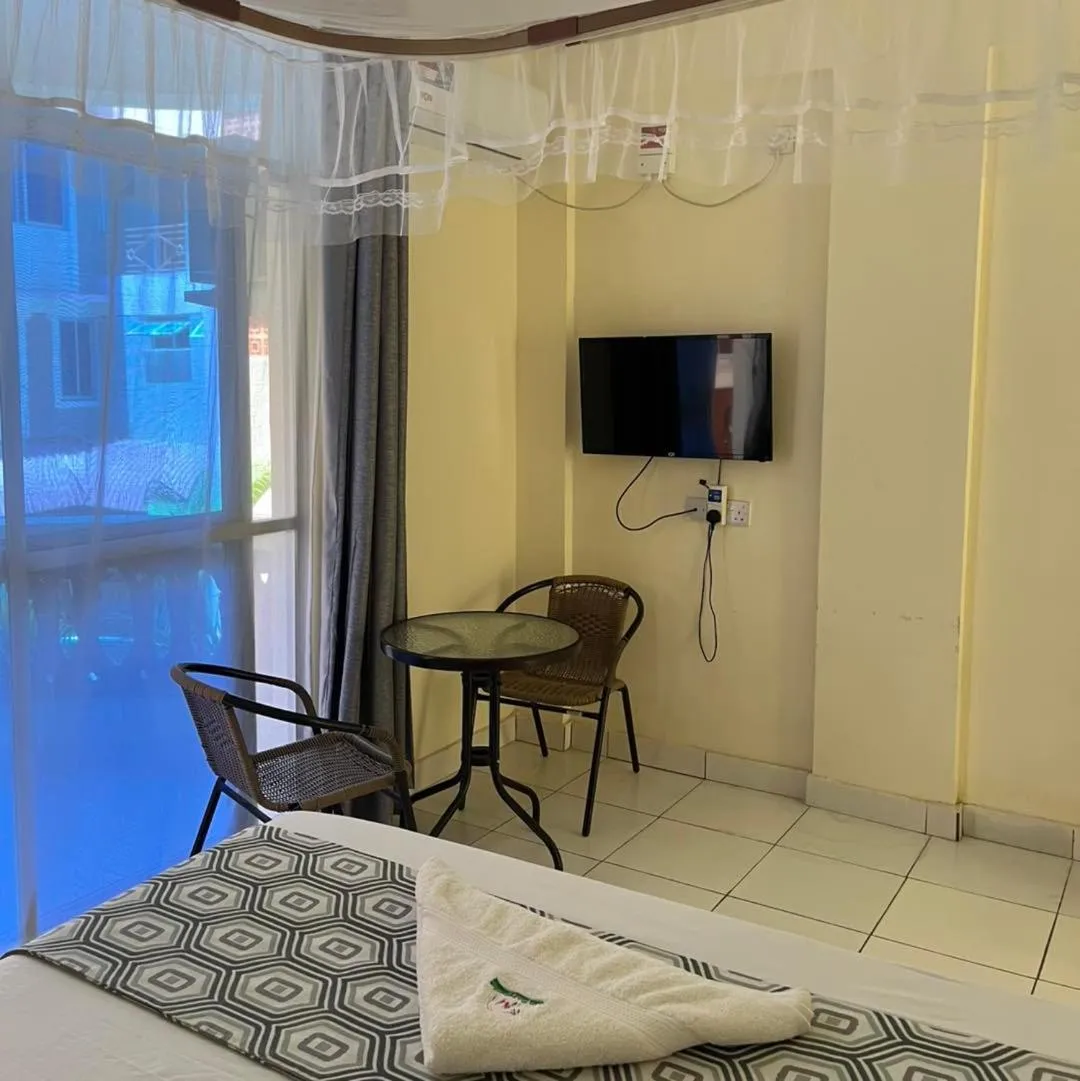 Bed in Merry Villa Hotel & Apartments