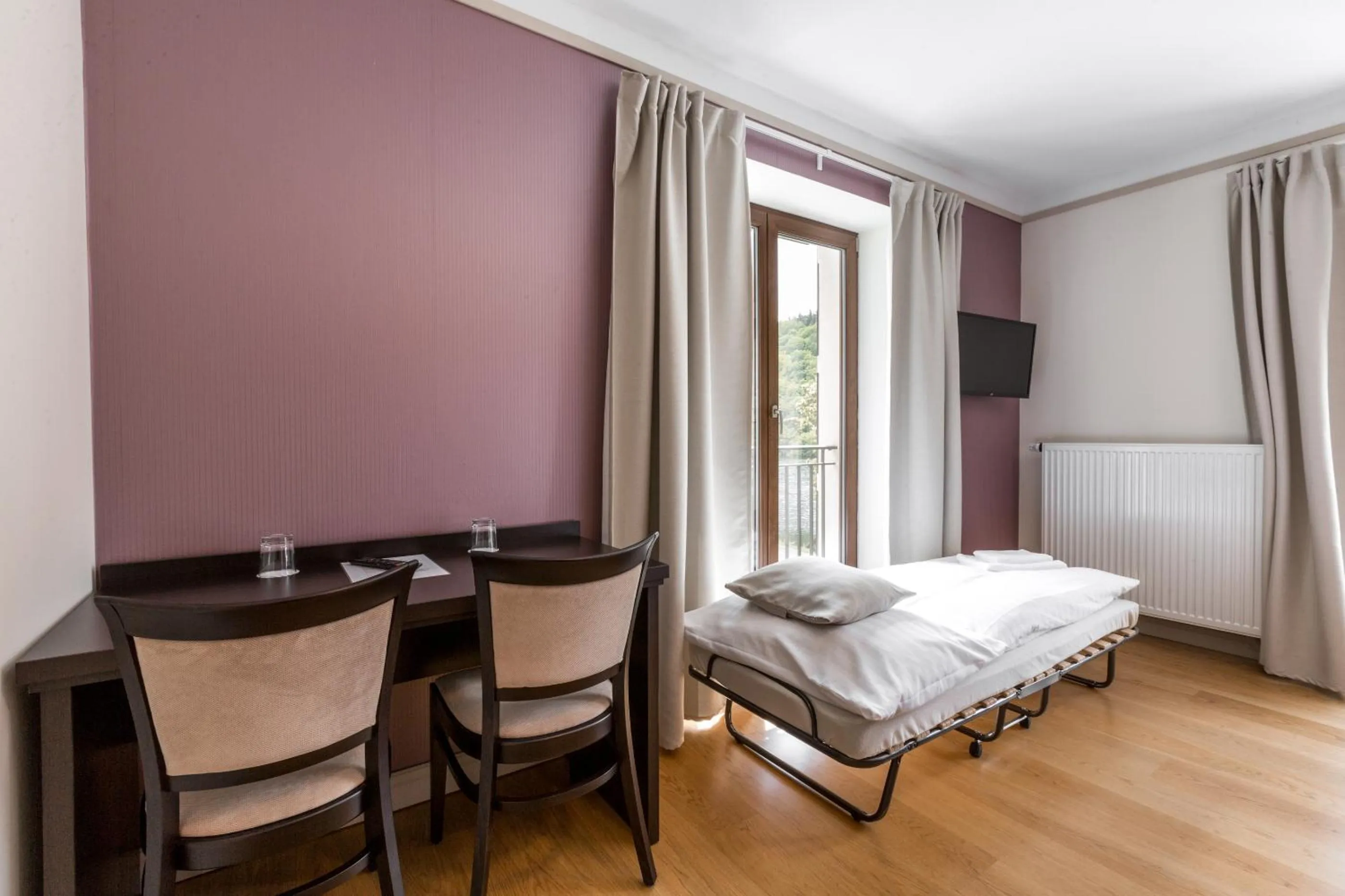 Seating area, Bed in Hotel Mandát