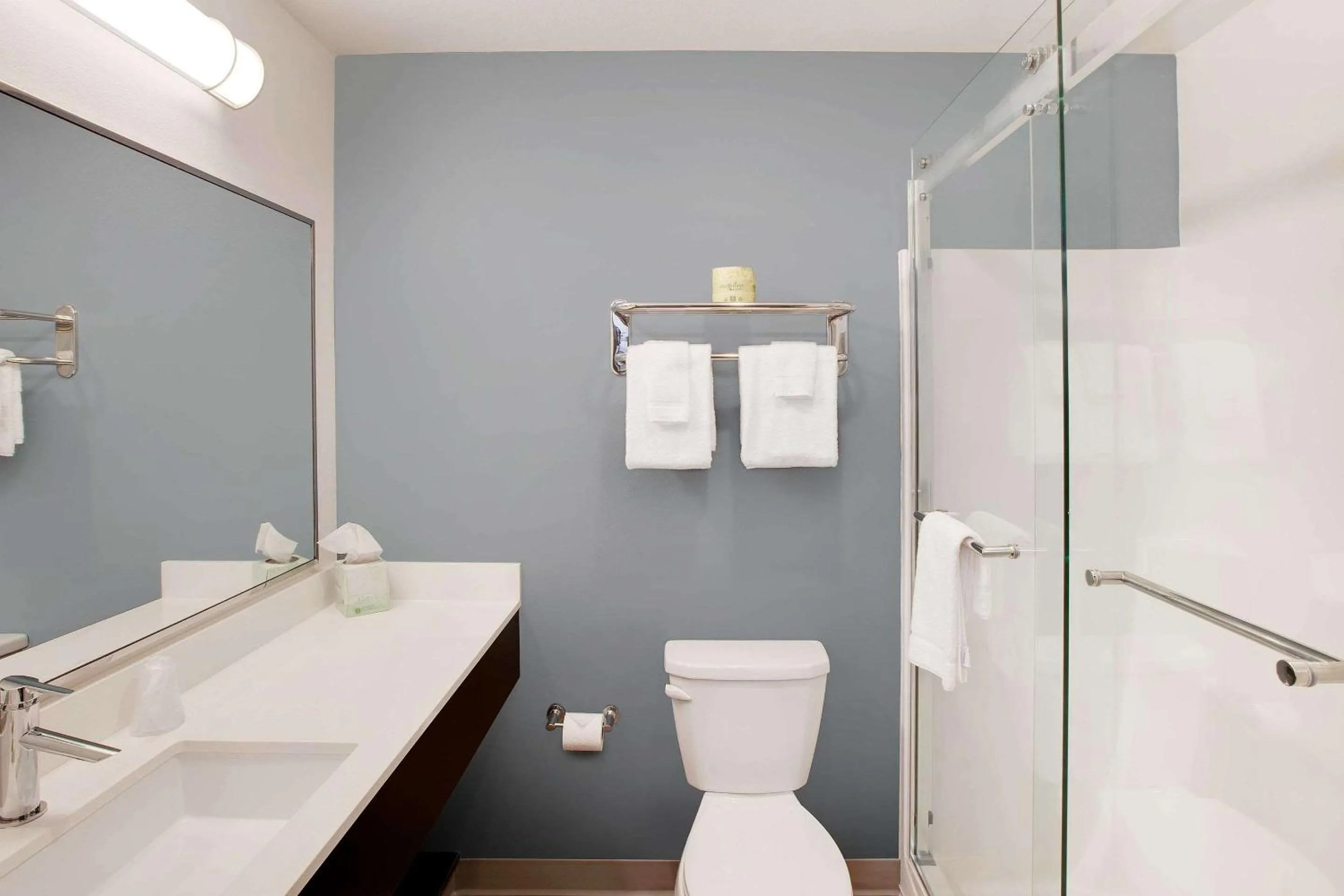 Bathroom in WoodSpring Suites Plano - North Dallas