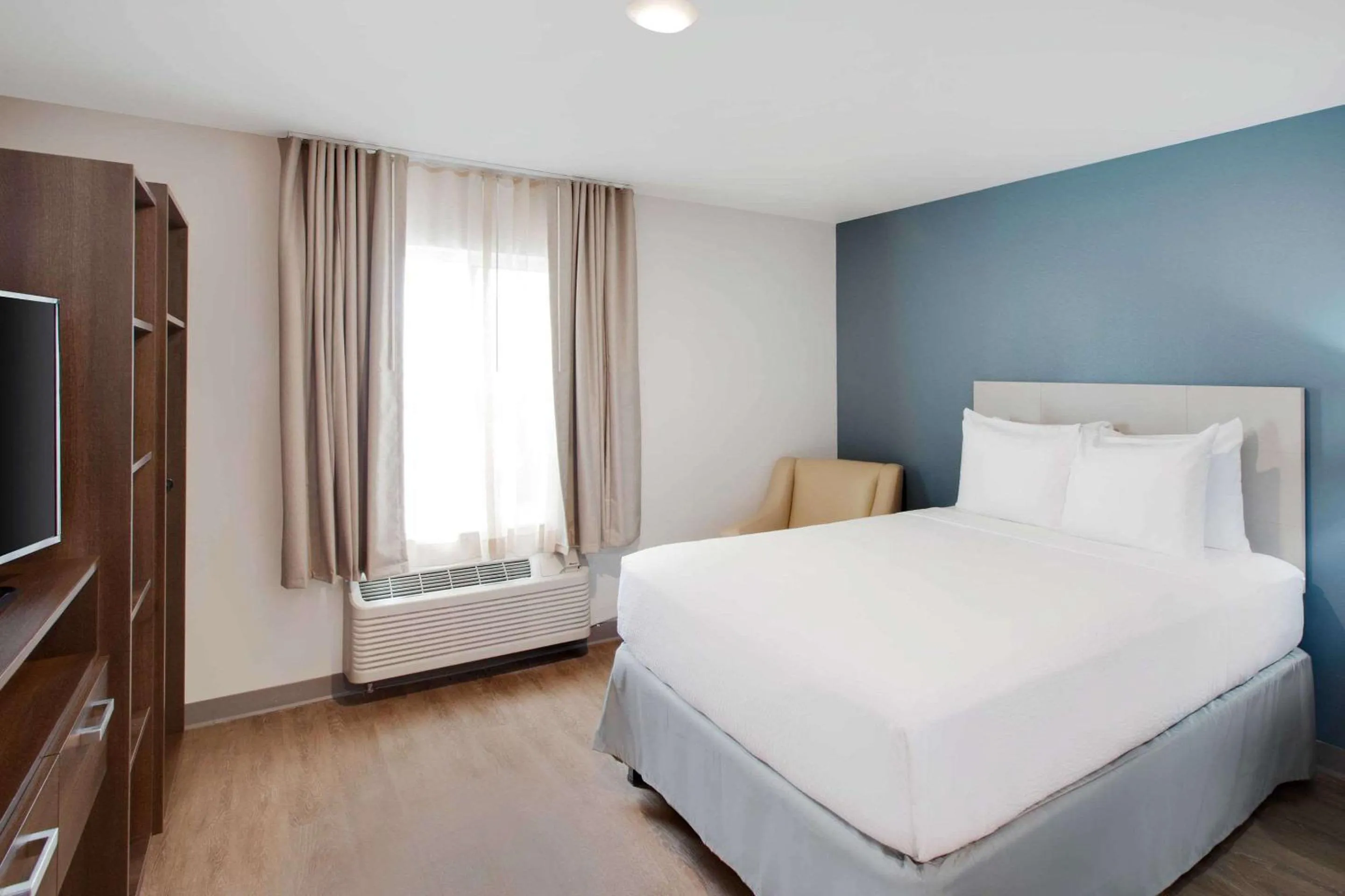 Photo of the whole room, Bed in WoodSpring Suites Plano - North Dallas