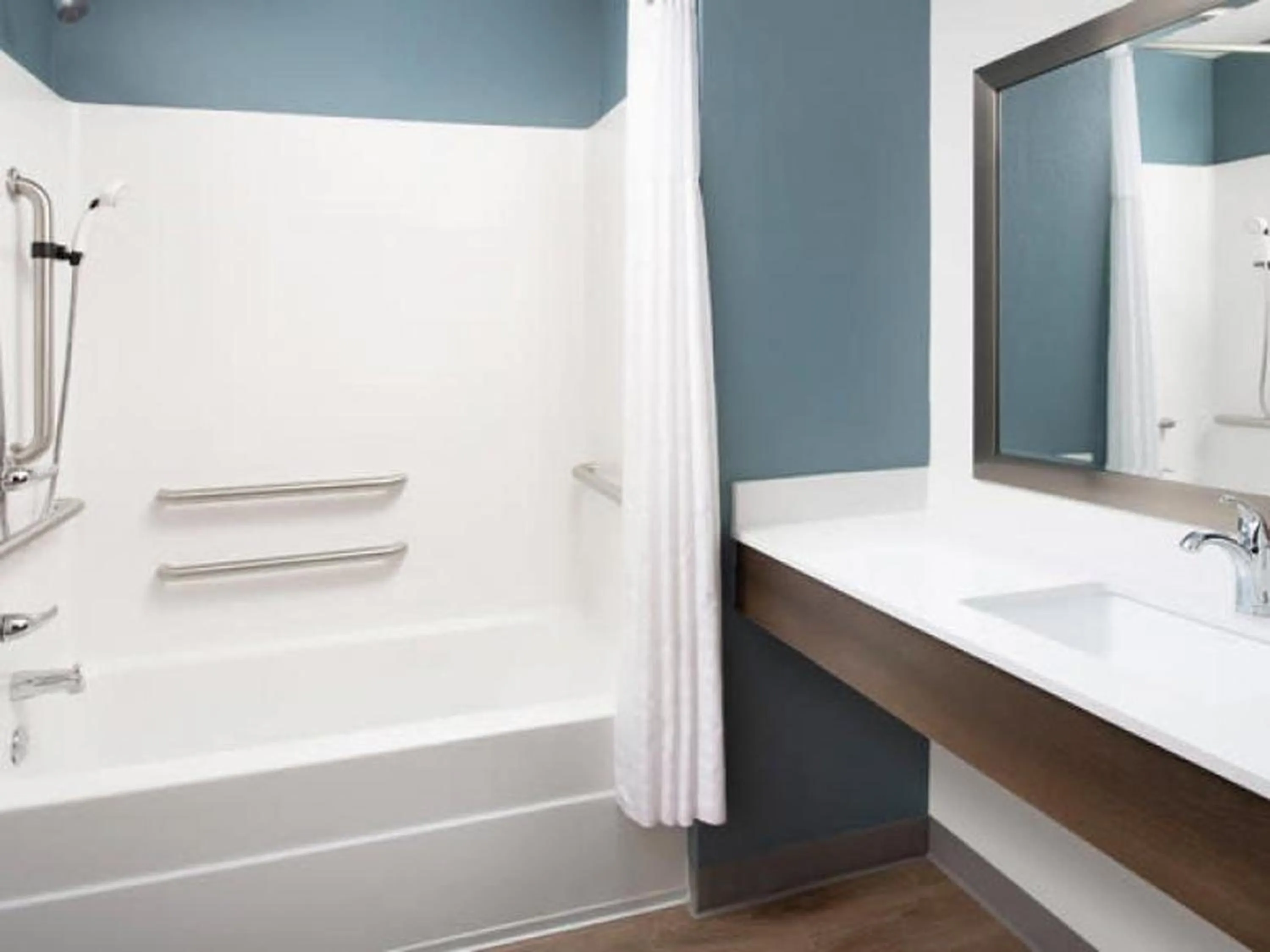 Bathroom in WoodSpring Suites Plano - North Dallas