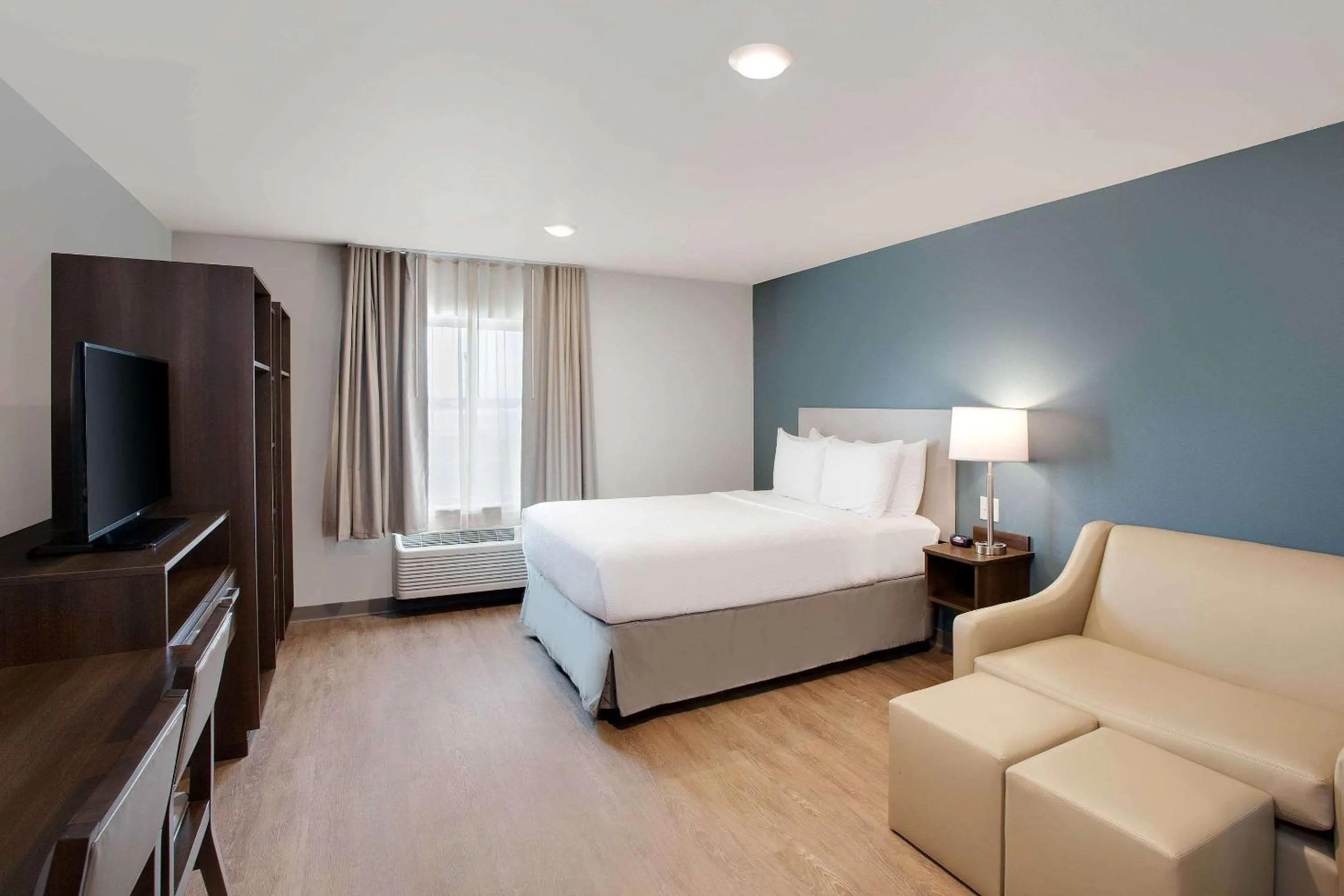 Photo of the whole room, Bed in WoodSpring Suites Plano - North Dallas