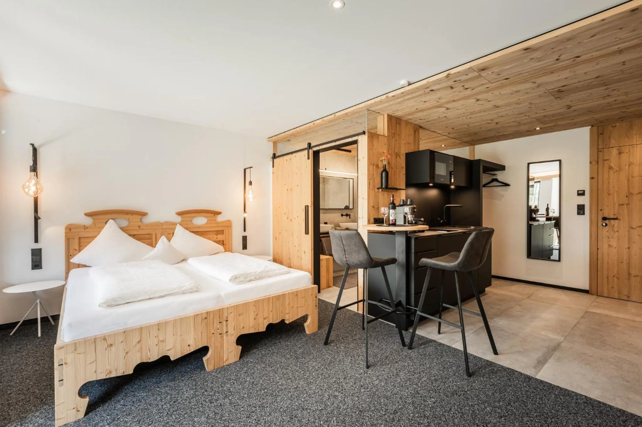 Bed in s'Hoamatl Dorfkrug Appartements