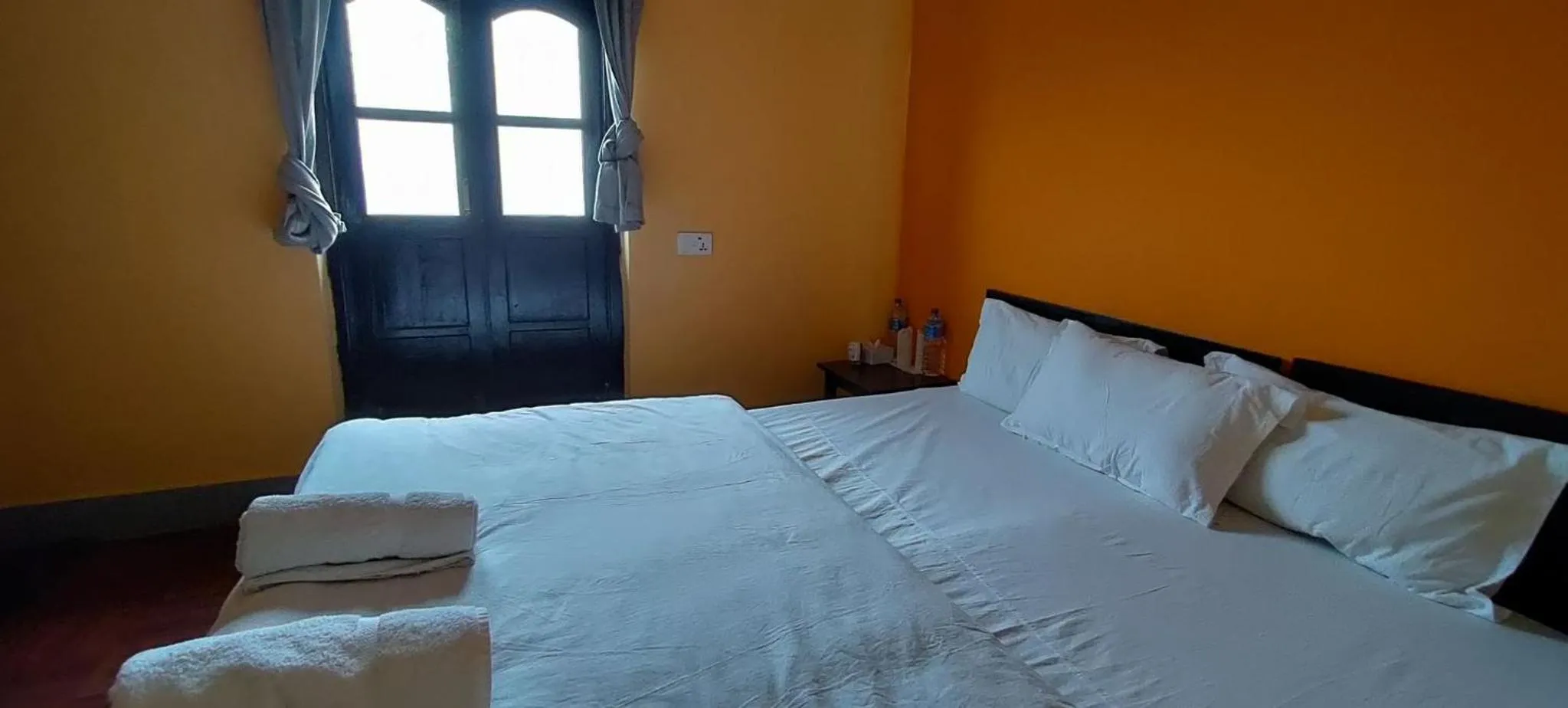 Bed in Bandipur Kaushi Inn