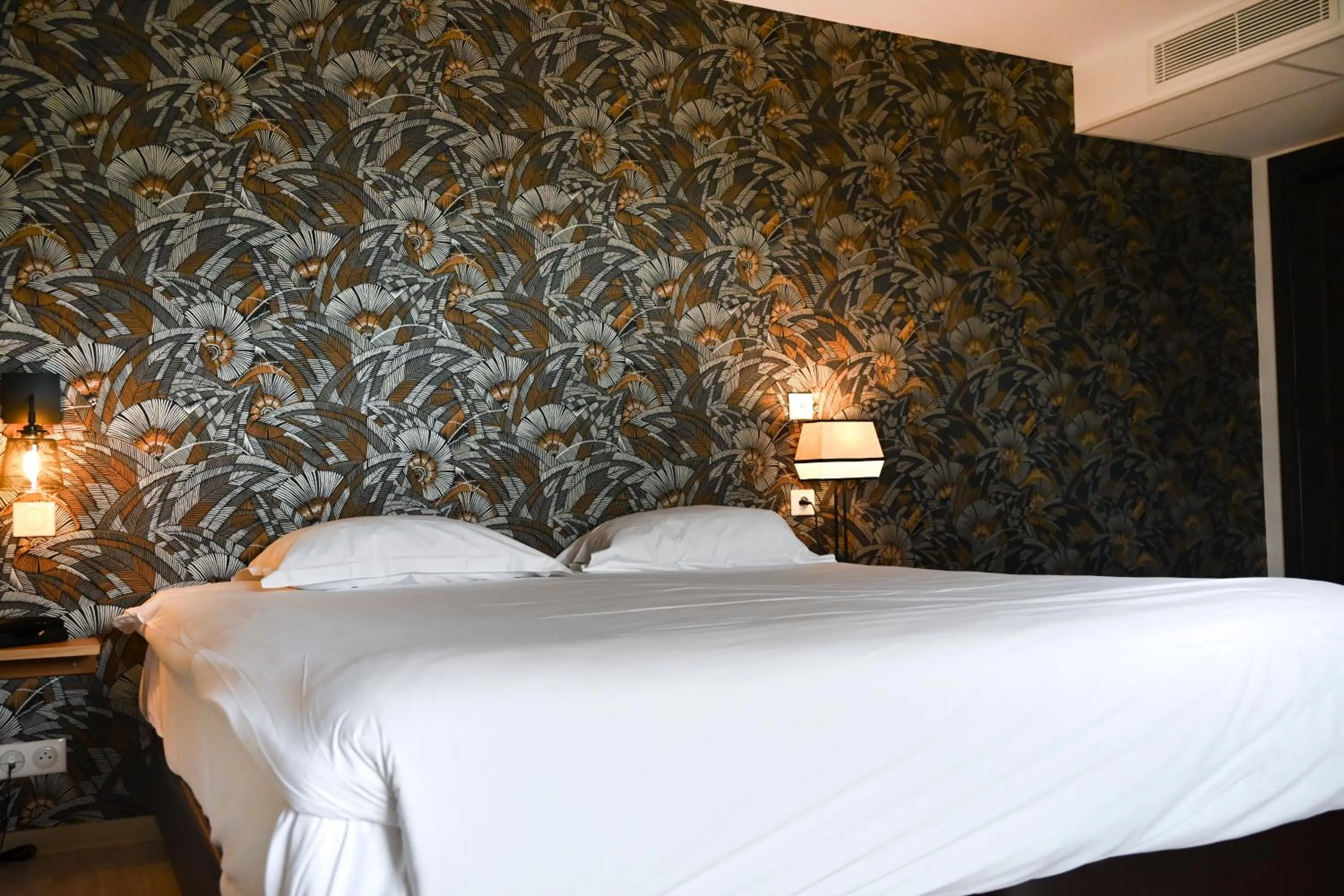 Bed in Hôtel Les Muses