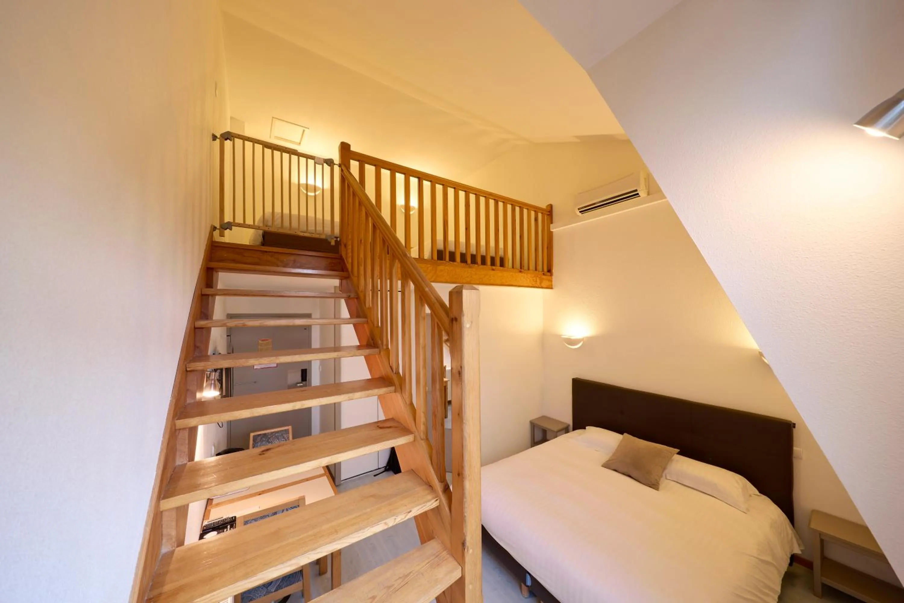 Photo of the whole room, Bed in Hôtel-Restaurant Le Calice Du Gevaudan - A75