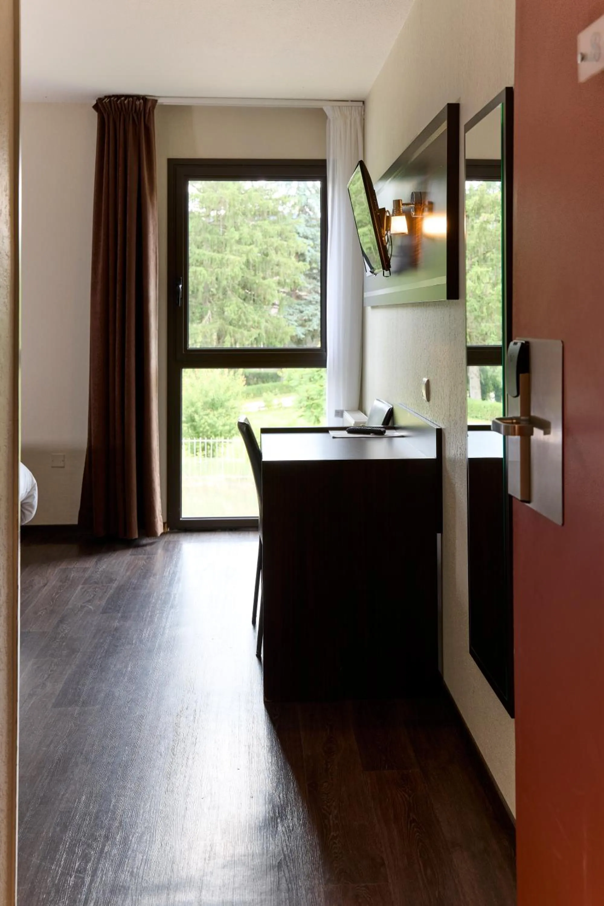 Bedroom in Hôtel-Restaurant Le Calice Du Gevaudan - A75