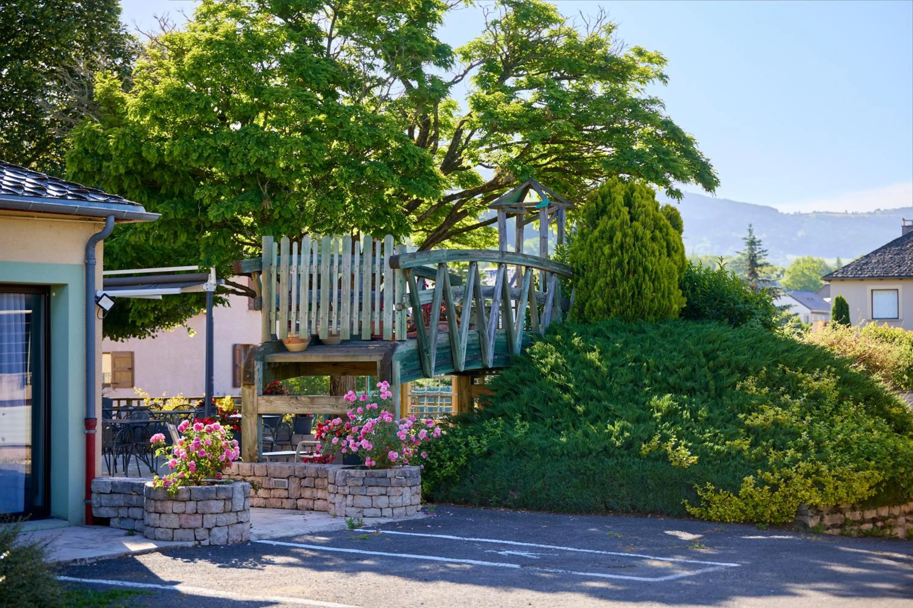 Garden in Hôtel-Restaurant Le Calice Du Gevaudan - A75