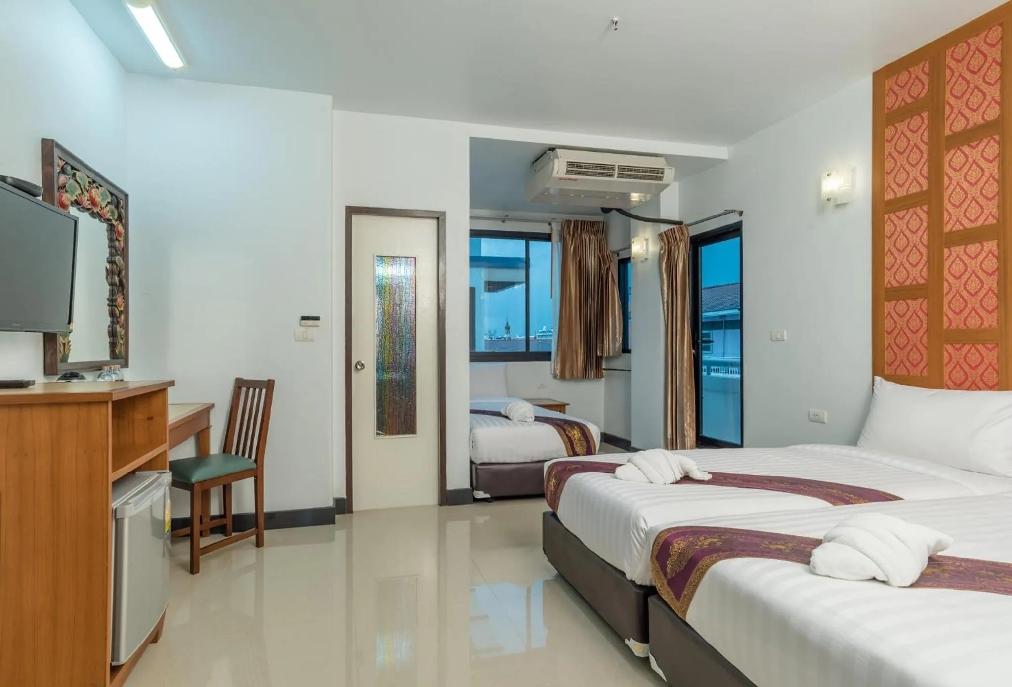 Bed in New Siam Palace Ville Hotel