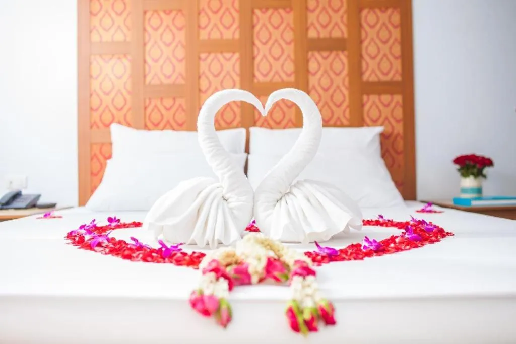 Bed in New Siam Palace Ville Hotel