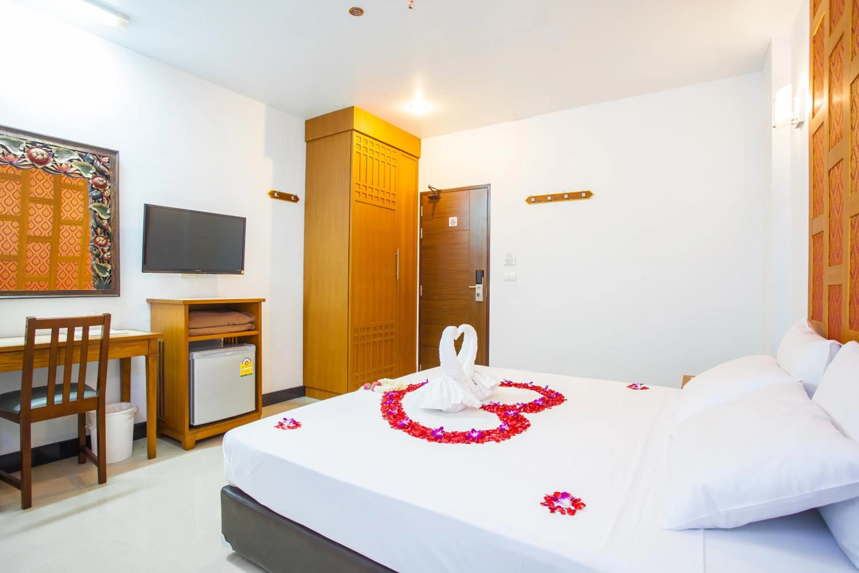 Bed in New Siam Palace Ville Hotel