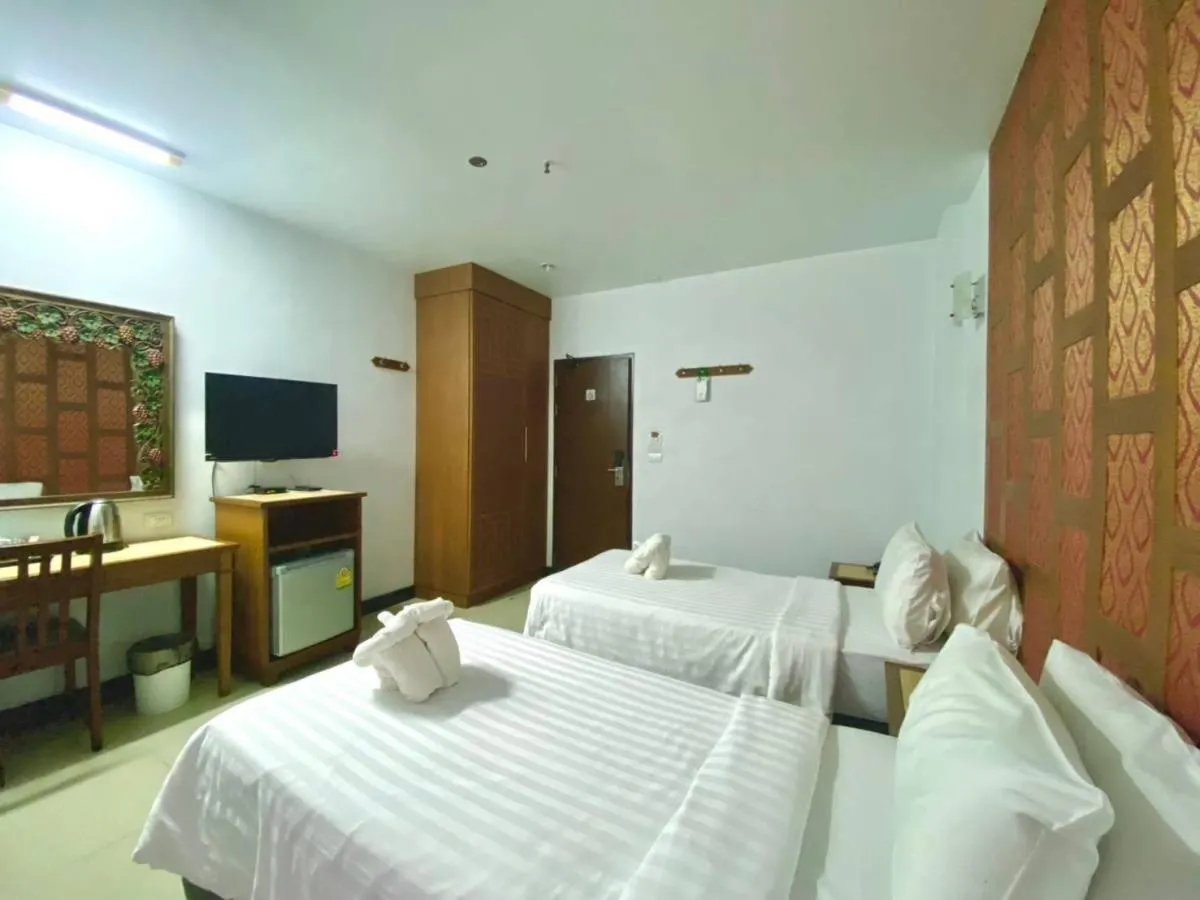 Bed in New Siam Palace Ville Hotel