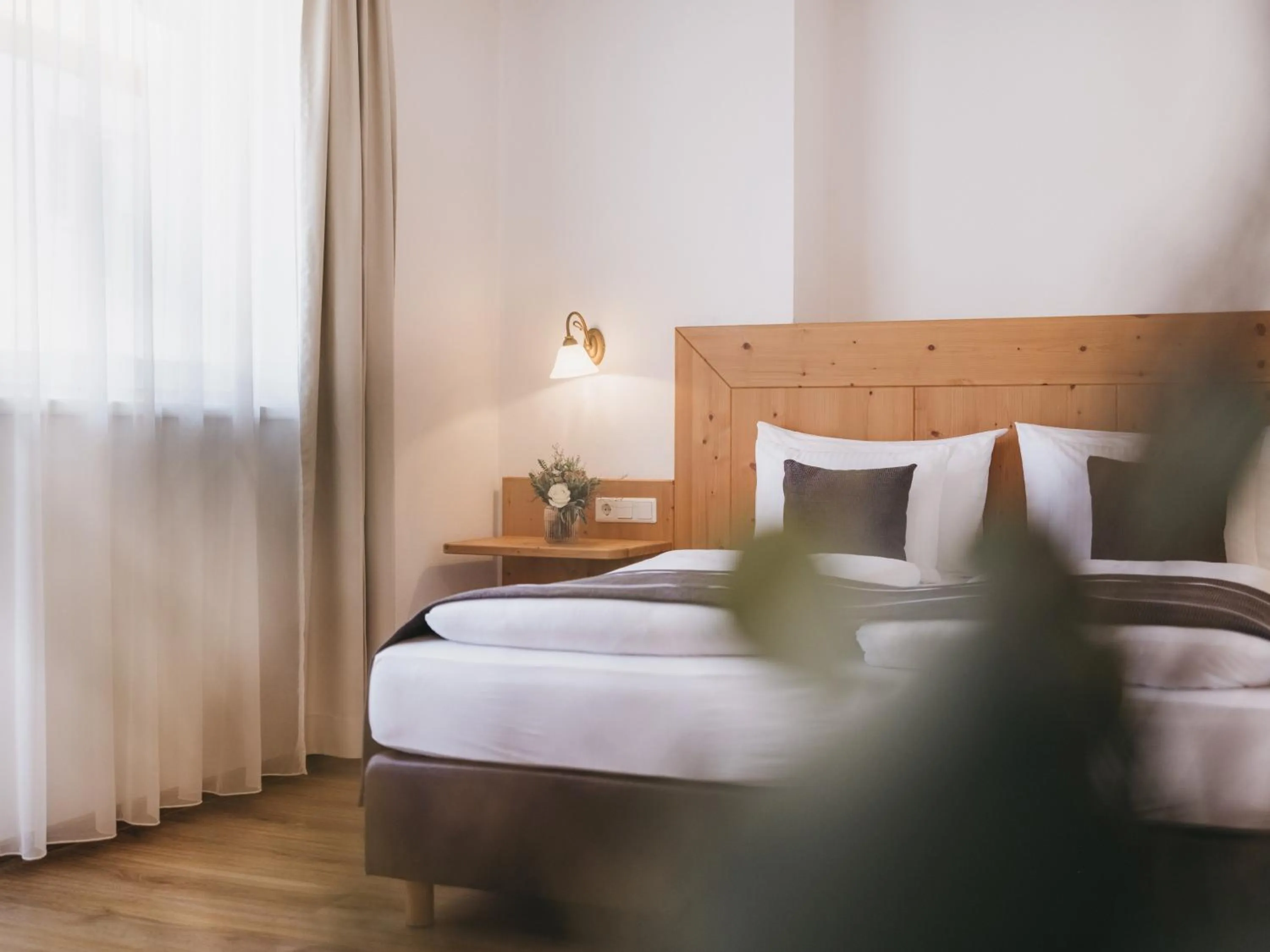 Bed in Hotel Vier Jahreszeiten by VAYA