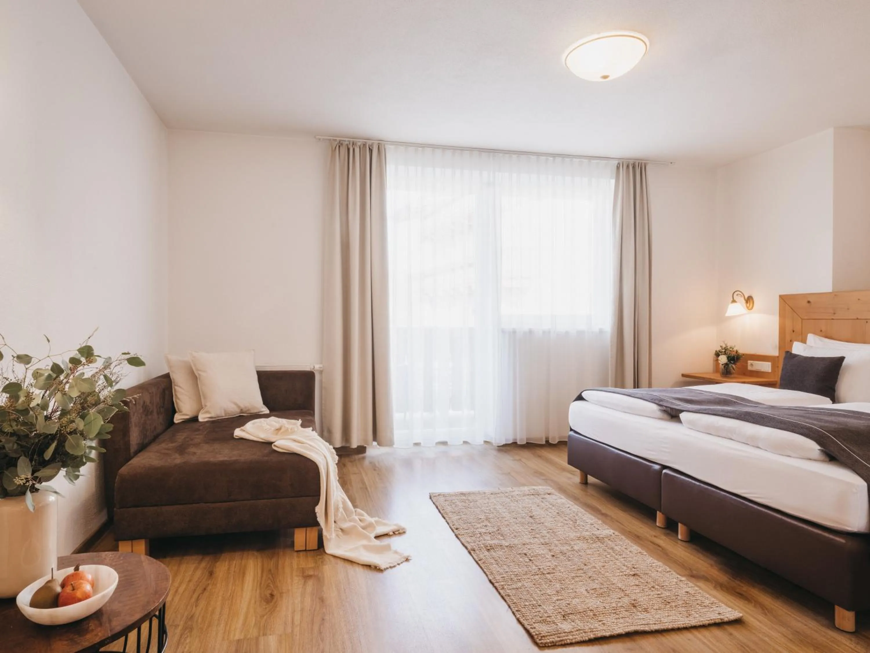 Bed in Hotel Vier Jahreszeiten by VAYA