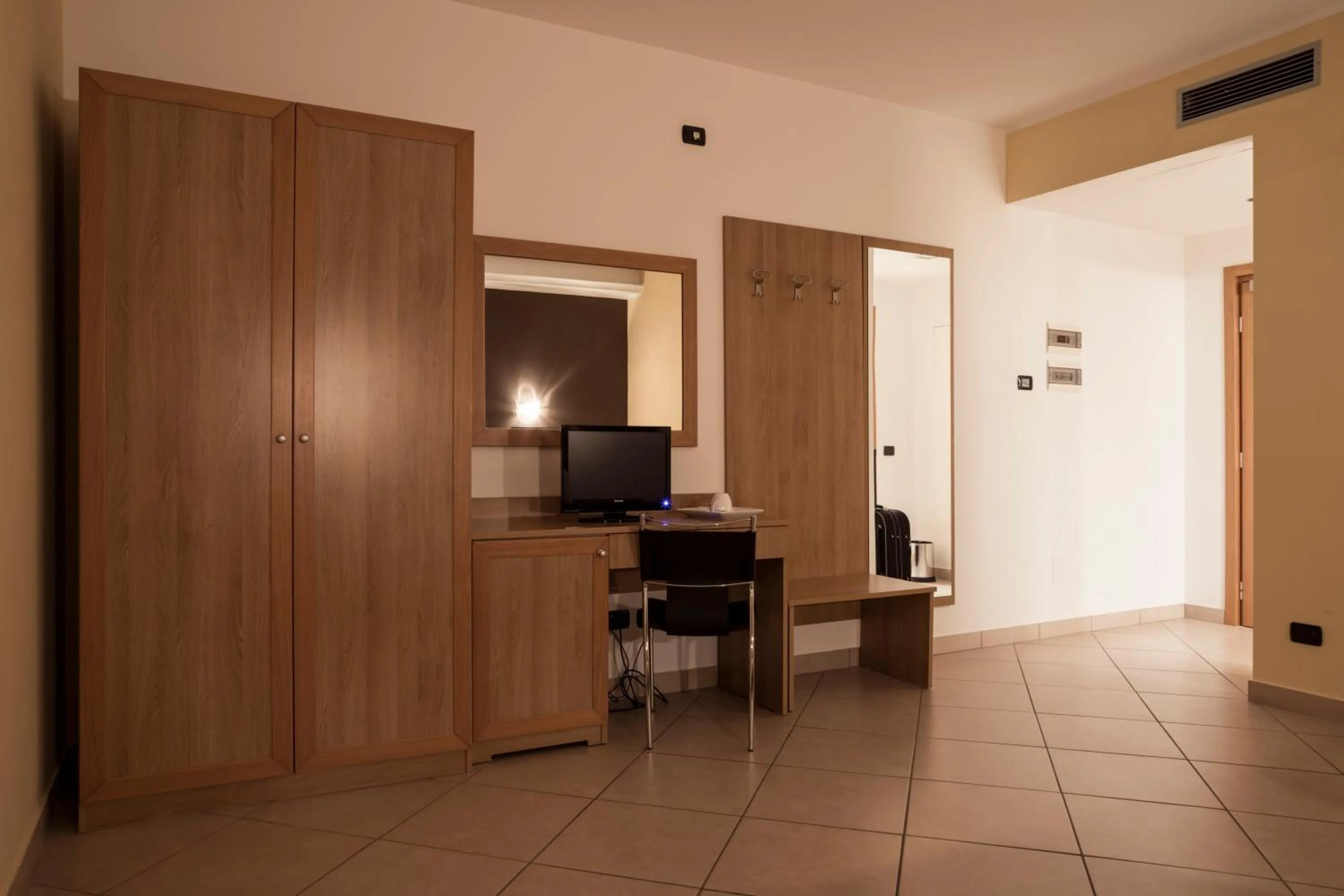 Bed in Manhattan Village Hotel