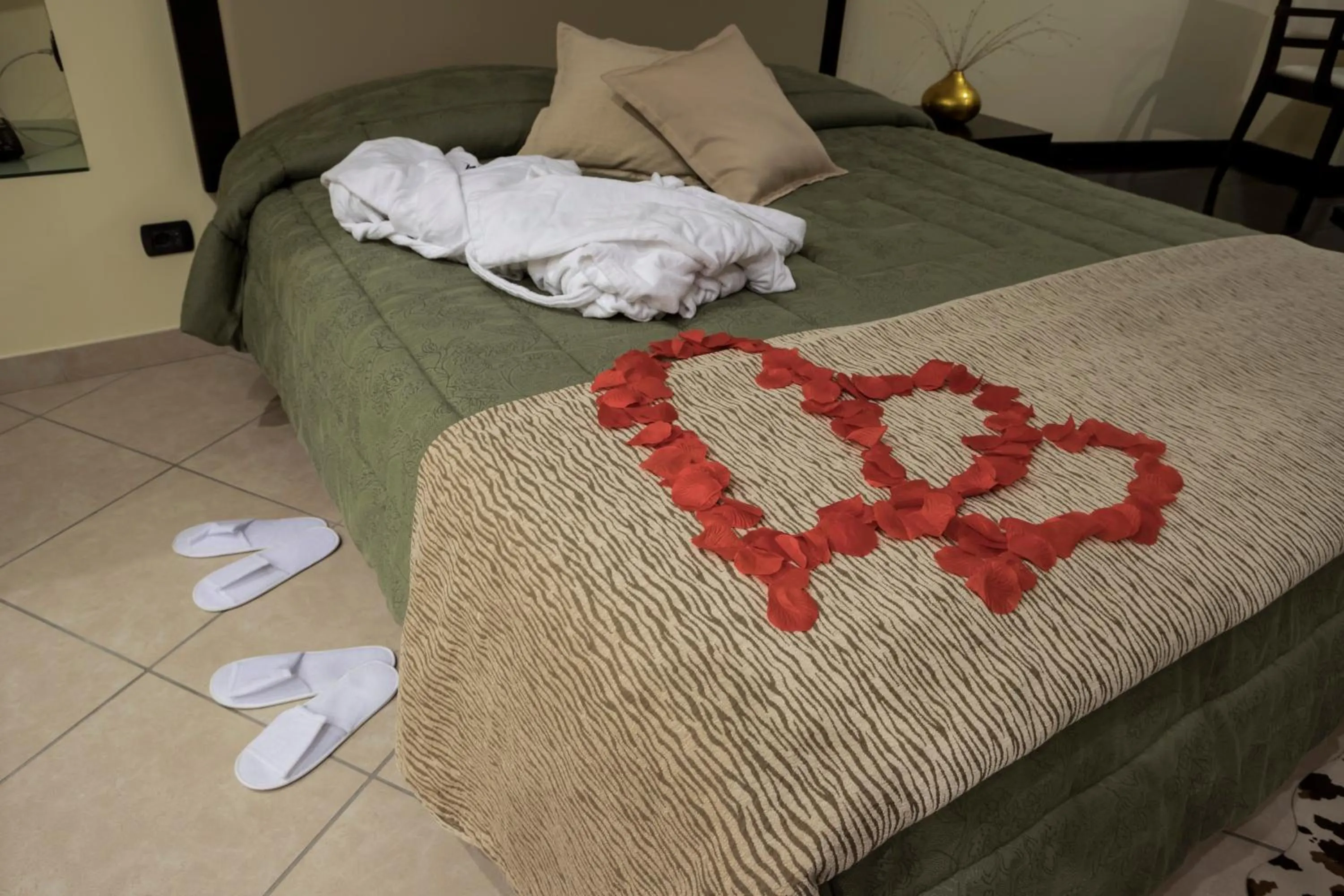 Bed in Manhattan Village Hotel