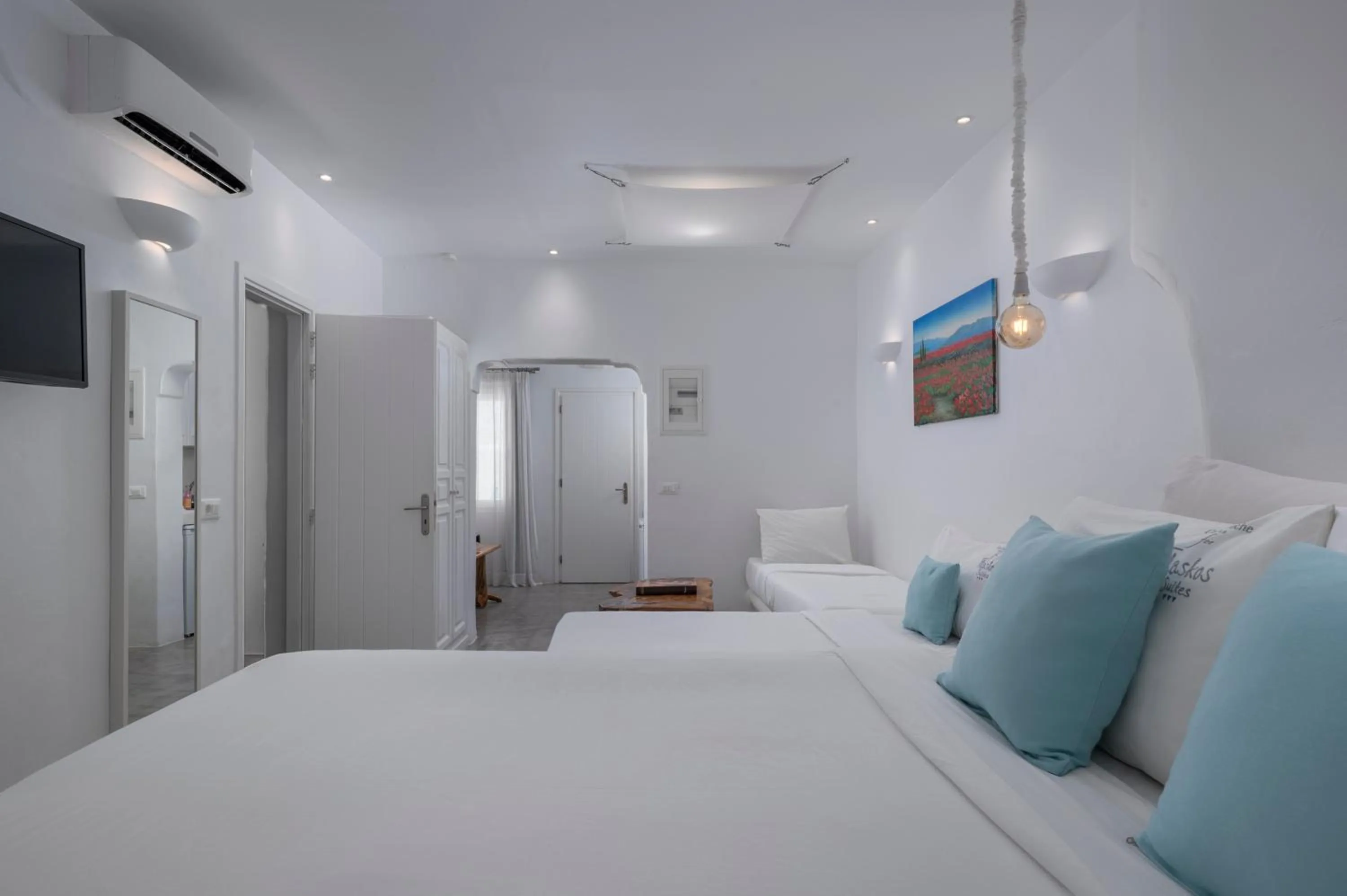 Bed in Flaskos Luxury Suites