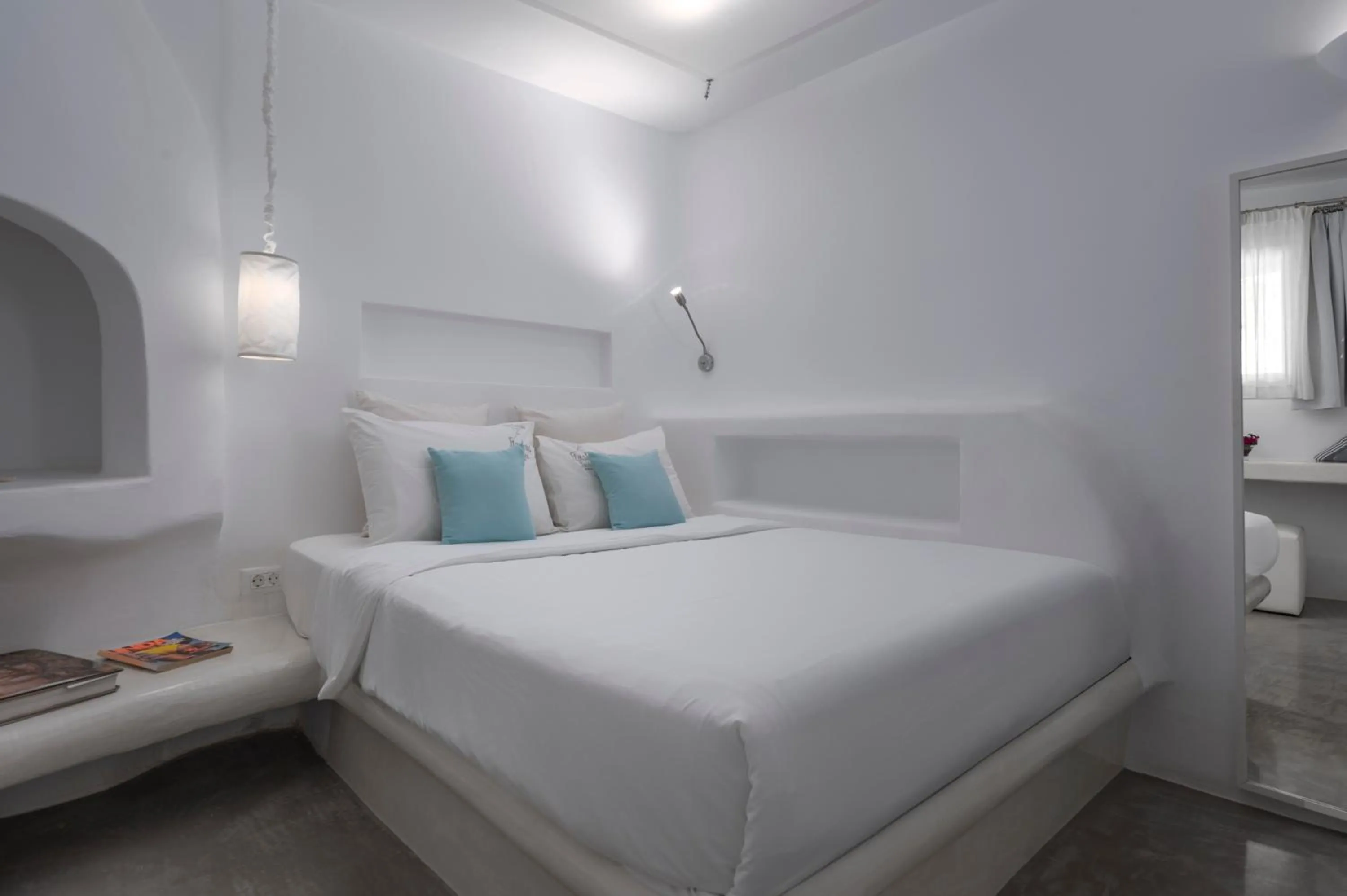 Bed in Flaskos Luxury Suites