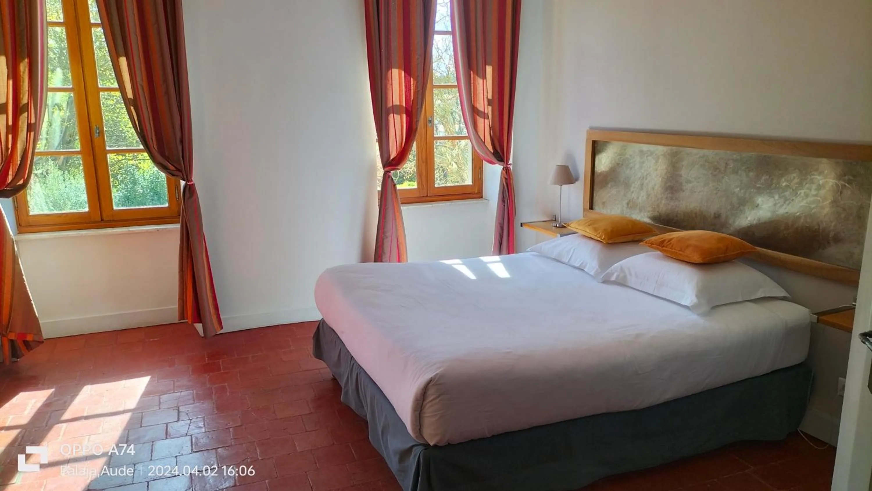 Bed in Logis Hôtel Château De Palaja